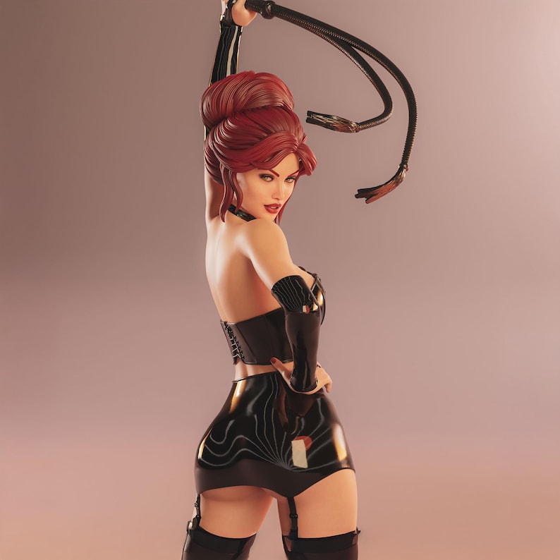 May include: A figurine of a woman with red hair, wearing a black corset, skirt, and gloves, holding a whip. The figure has a confident pose, with a slight smile. The background is a gradient of pink and peach.