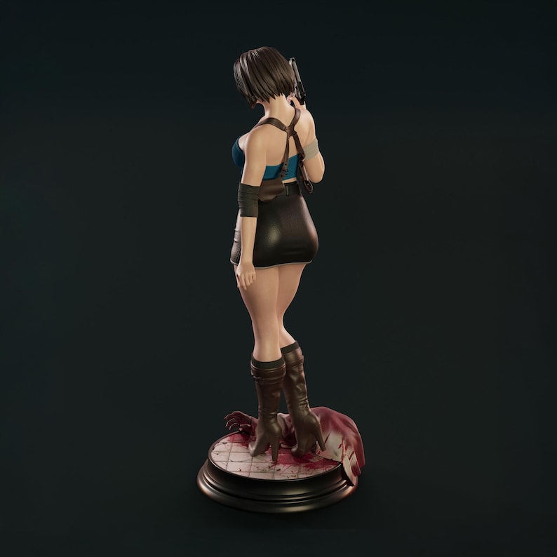May include: A detailed figurine of a woman in a blue top, black skirt, and brown boots, holding a gun. The figure is posed on a circular base with a bloody scene. The color scheme is dark, highlighting the character's outfit and stance.