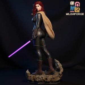 May include: A detailed statue of a female figure with red hair, wearing a black bodysuit, brown boots, and a tan cape. She holds a purple lightsaber. The statue is on a rocky base. The logo "MILDAFORGE" is in the upper right corner.