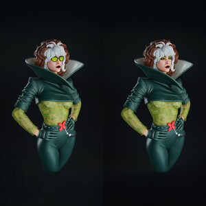 Pode incluir: Um busto de Rogue dos X-Men, com um esquema de cores verde e branco. A figura tem uma parte superior e cal&ccedil;as verdes, com um padr&atilde;o texturizado nos bra&ccedil;os e no torso. O busto tem um penteado branco e castanho e usa uma jaqueta e luvas verdes.
