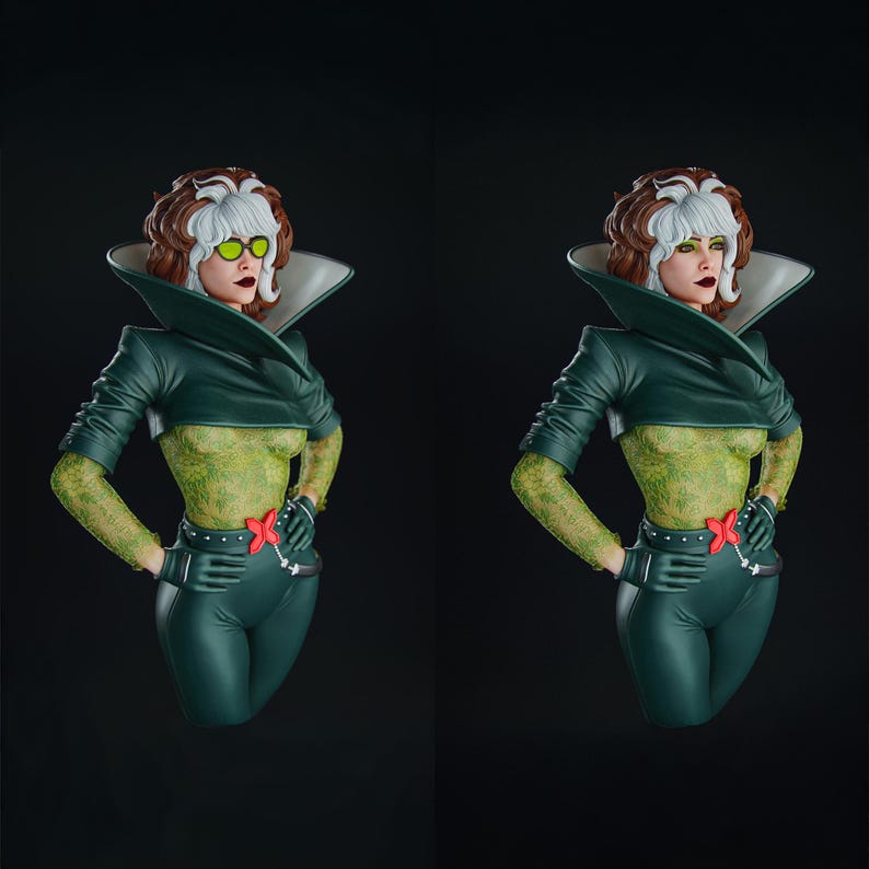 Pode incluir: Um busto de Rogue dos X-Men, com um esquema de cores verde e branco. A figura tem uma parte superior e cal&ccedil;as verdes, com um padr&atilde;o texturizado nos bra&ccedil;os e no torso. O busto tem um penteado branco e castanho e usa uma jaqueta e luvas verdes.