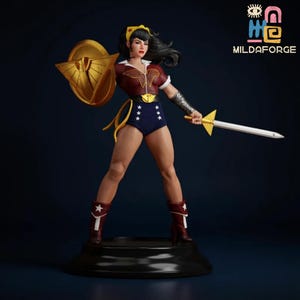 May include: A Wonder Woman figurine stands on a black base, holding a golden shield and sword. She wears a red and white top, blue shorts with white stars, and red boots. The figurine has black hair and a yellow headband. The logo "MILDAFORGE" is in the upper right corner.