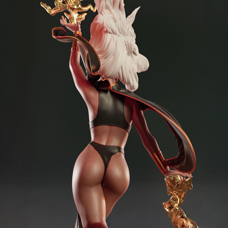 May include: A detailed figurine of a character with white hair and a black outfit. The figure is holding a golden staff with intricate details. The outfit includes a cape with orange trim. The figure is posed with one arm raised.