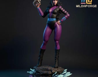 May include: Figurine of a woman in a purple and black bodysuit, holding a gun. The figure stands on a rock base with crystal formations. The logo "MILDAFORGE" is visible.