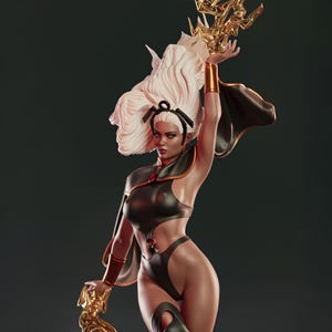 May include: A detailed statue of a character with white hair and a black and gold outfit. The figure is holding a golden object aloft, with a cape flowing behind. The statue has a dynamic pose and is set against a dark background.