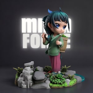 May include: A figurine of a young girl with teal hair and blue eyes, wearing a green top and pink pants, carrying a basket. The figurine stands on a rocky base with greenery and a small stream. The word "MIRROR FORCE" is in the background.