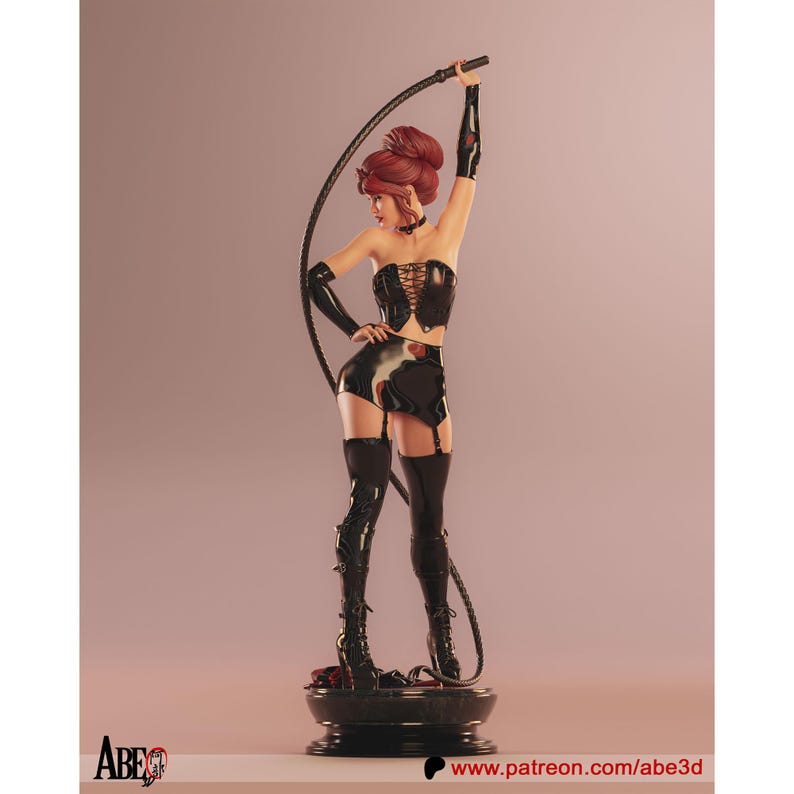 May include: A figurine of a woman in a black corset, shorts, and thigh-high boots, holding a whip. The figure has red hair and is posed on a round, black base. The background is a soft pink.