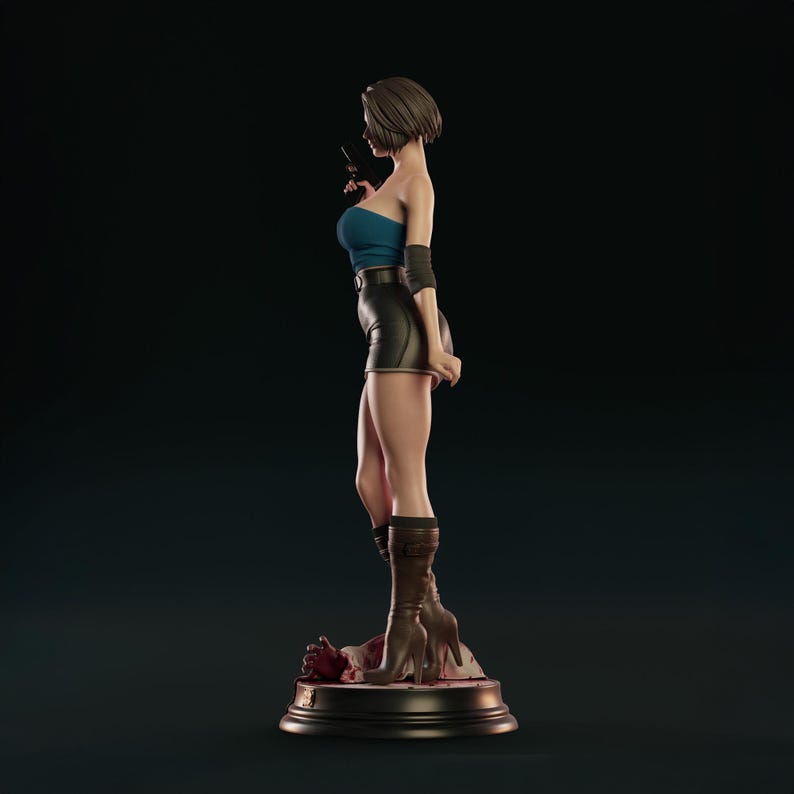 May include: A detailed figurine of a woman in a blue tube top, black shorts, and brown boots, holding a gun. The figure stands on a round base with a dark background. The figurine is approximately 30 cm tall.