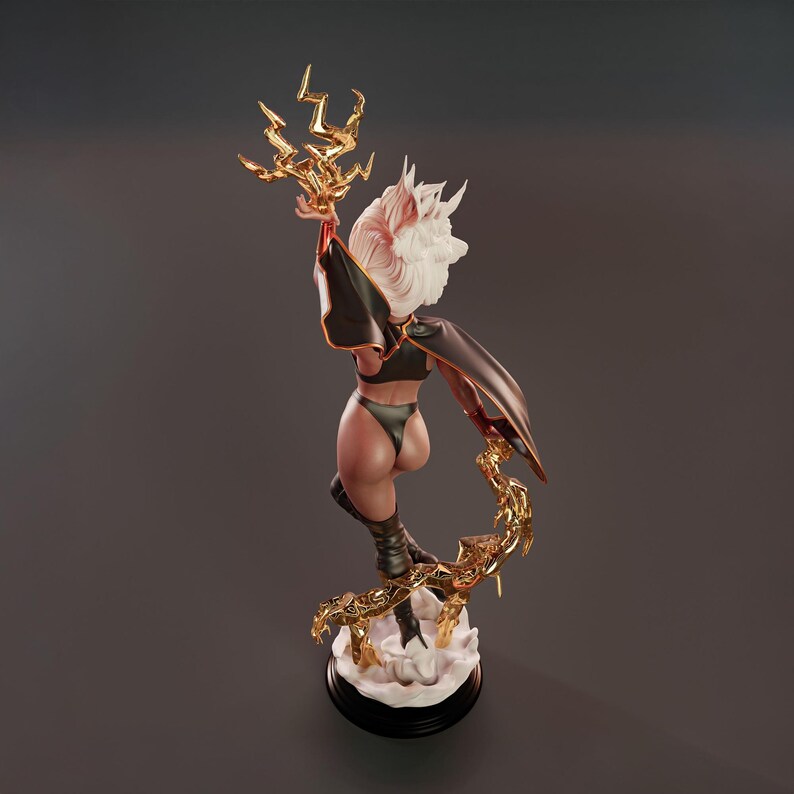 May include: A detailed figurine of a character in a black outfit with a cape, holding a golden lightning bolt. The figure has white hair and is posed dynamically on a cloud-like base, with a golden lightning-shaped support.