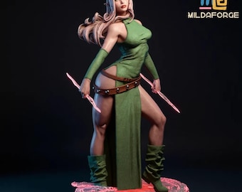 May include: A detailed figurine of a female elf in a green dress, holding two pink glowing blades. The elf has long blonde hair and is standing on a pink, glowing base. The text "MILDAFORGE" is visible in the upper right corner.