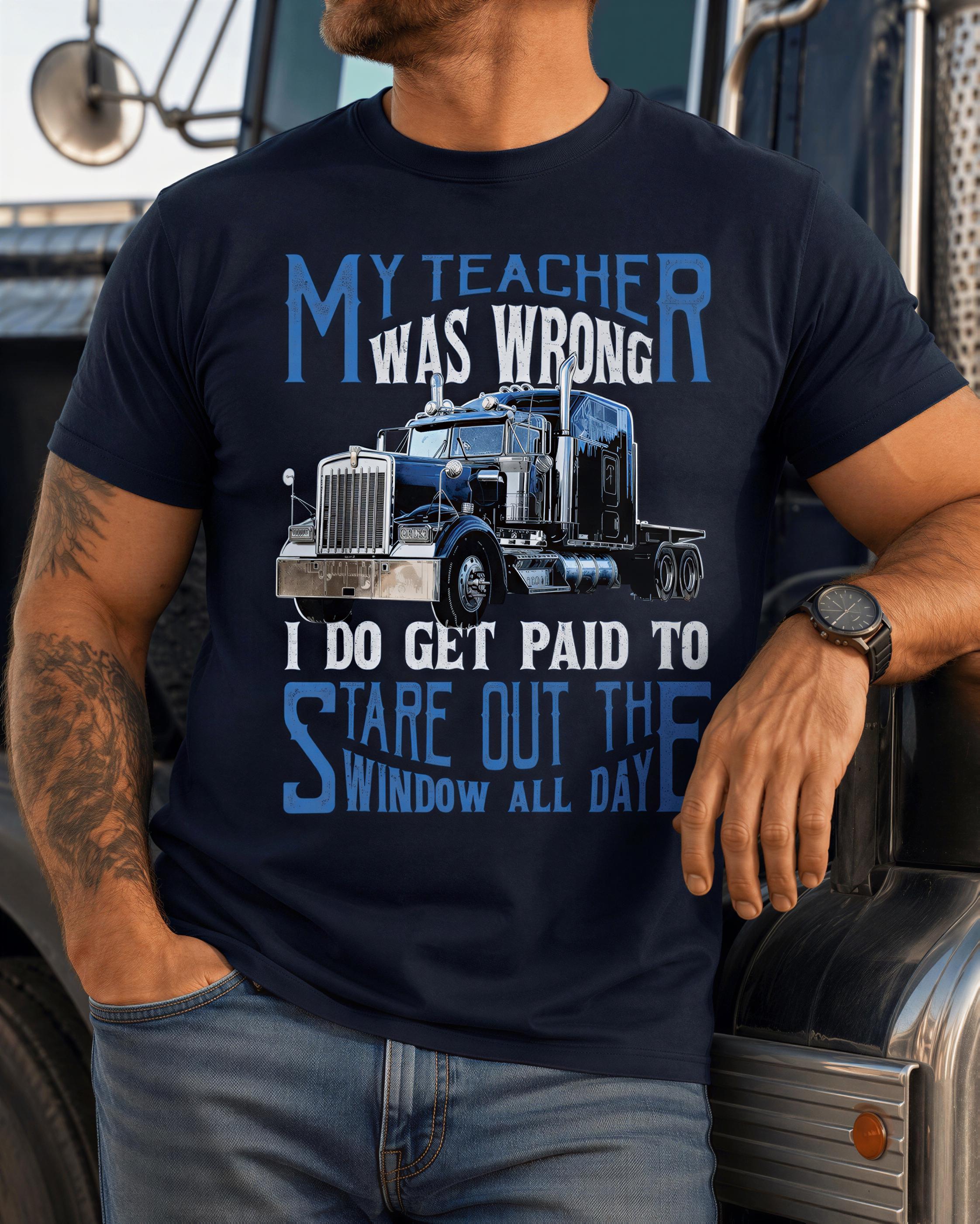 a man wearing a black t-shirt with a graphic design of a truck and text that reads "My teacher was wrong, I do get paid to stare out the window all day".
