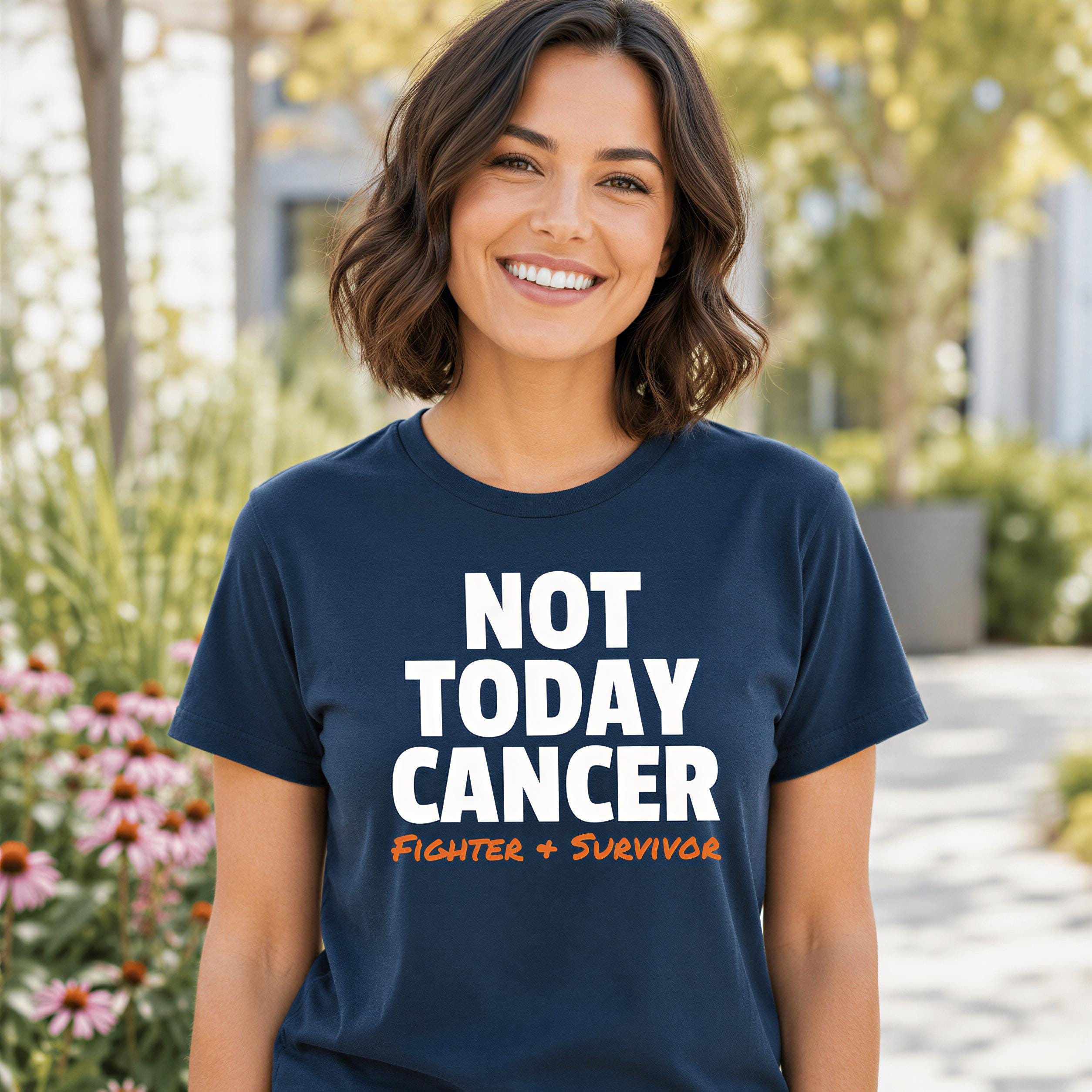 A woman wearing a navy blue t-shirt with the text "NOT TODAY CANCER Fighter + Survivor" printed on it, smiling at the camera.