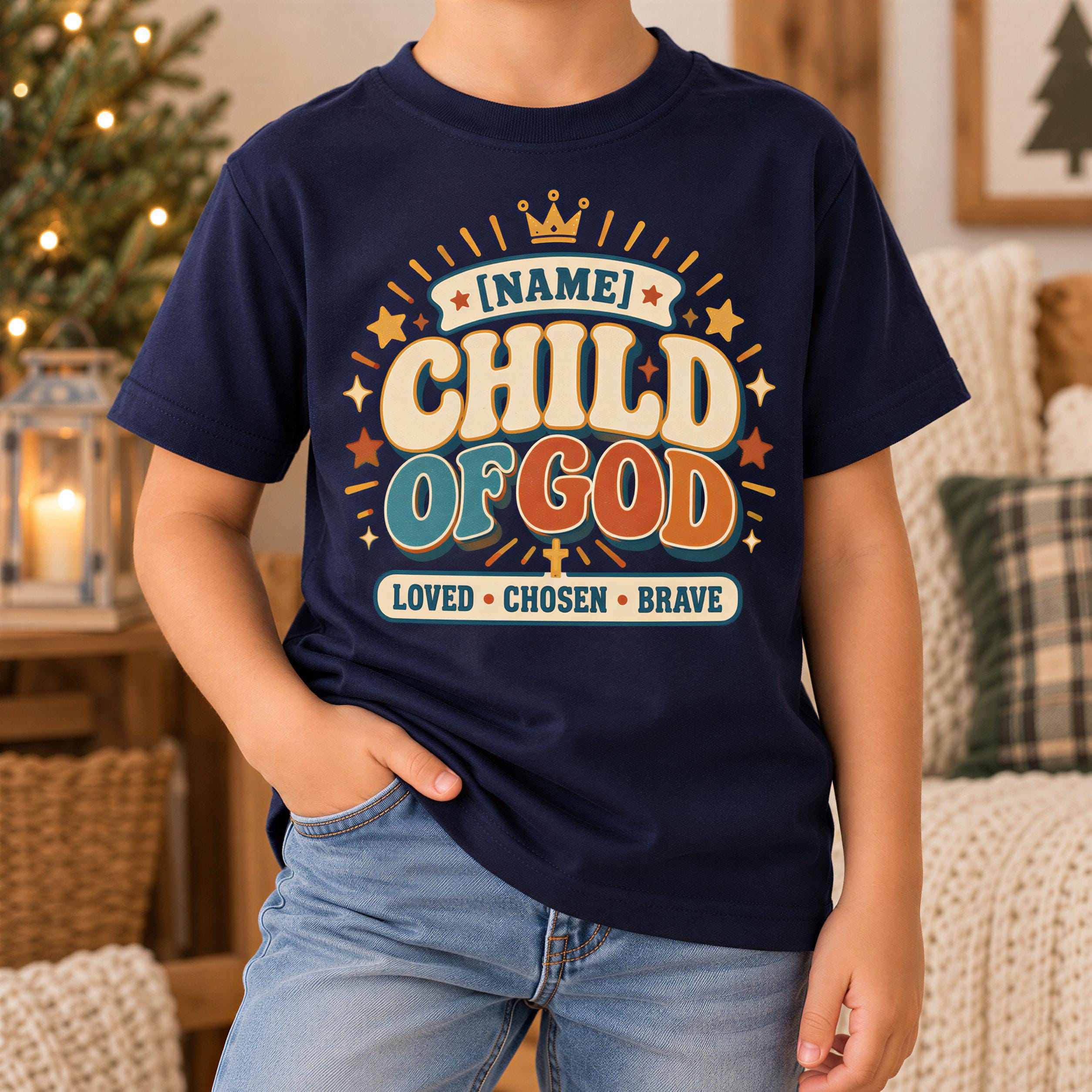 A person wearing a navy blue t-shirt with a colorful graphic design that says "NAME! CHILD OF GOD" and "LOVED - CHOSEN - BRAVE".
