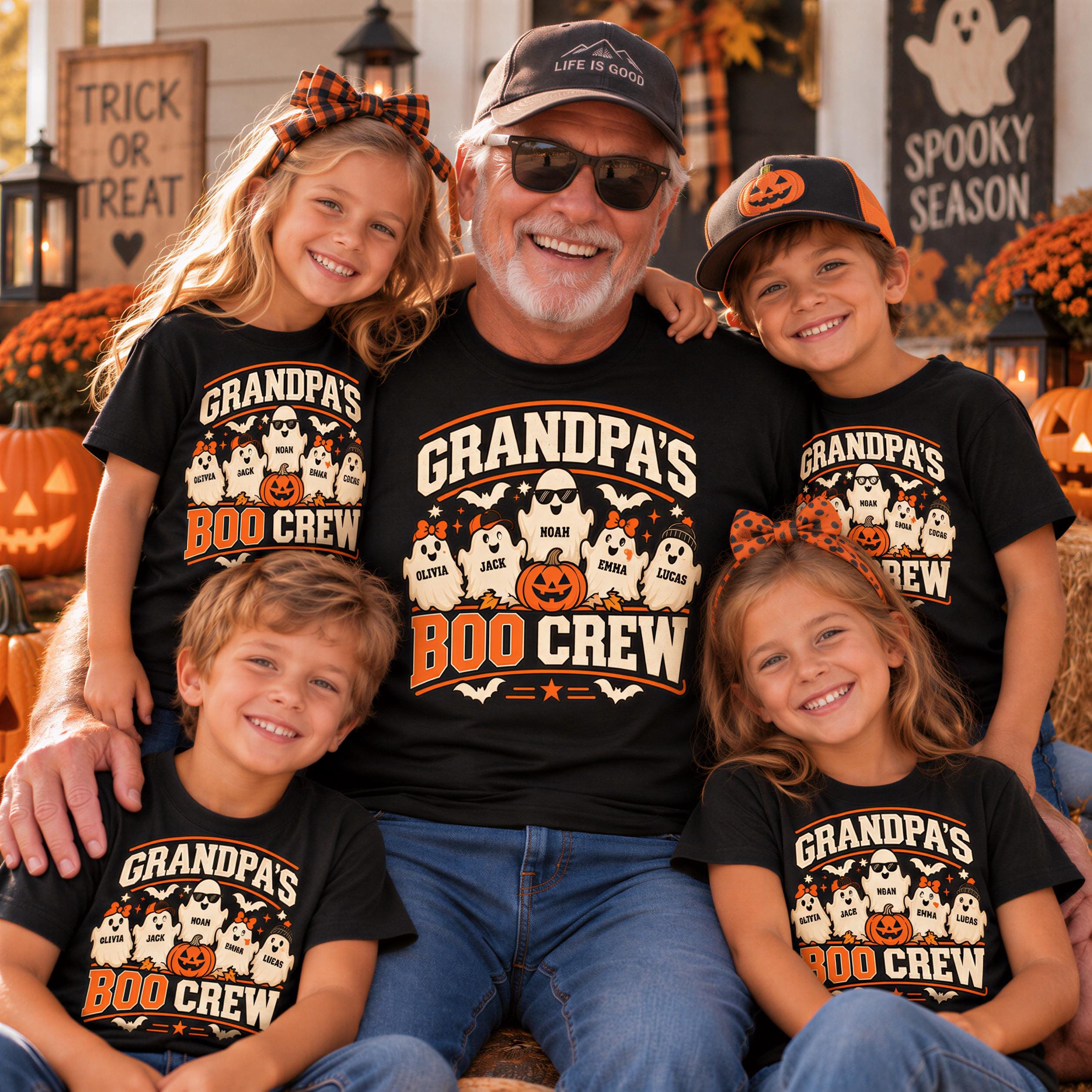 A group of five children wearing matching t-shirts with the text "Grandpa's Boo Crew" and Halloween-themed graphics, posing with an older man wearing a baseball cap and sunglasses.