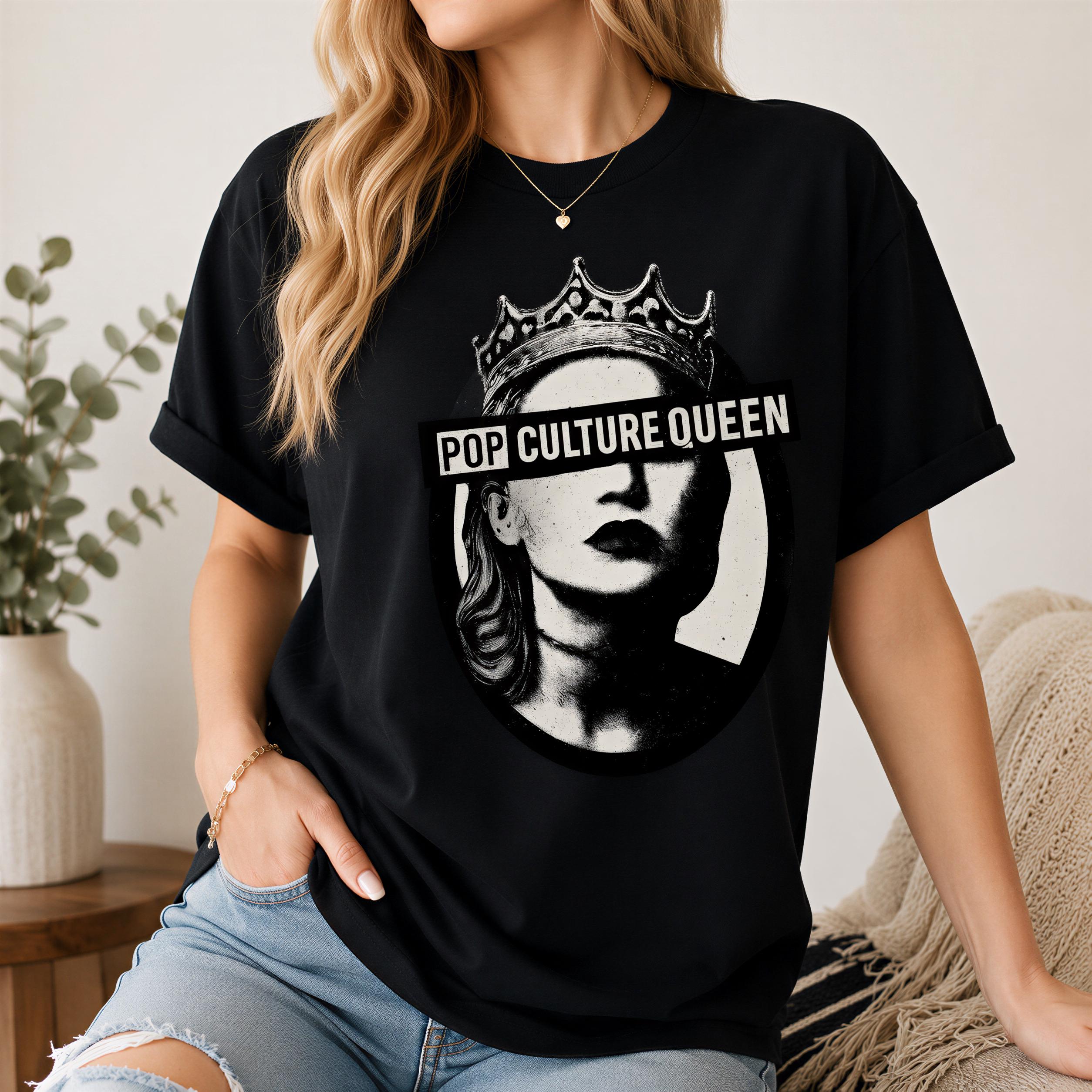 A woman wearing a black t-shirt with a graphic design of a woman's face wearing a crown and the text "POP CULTURE QUEEN" printed on it.