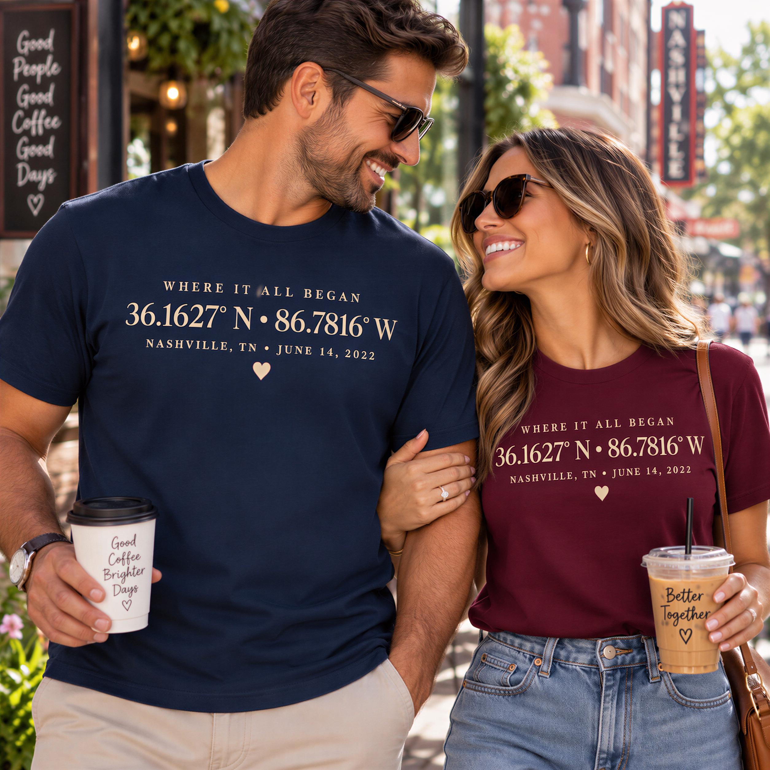 A man and a woman are standing together, smiling and holding drinks, with a sign for a coffee shop in the background.