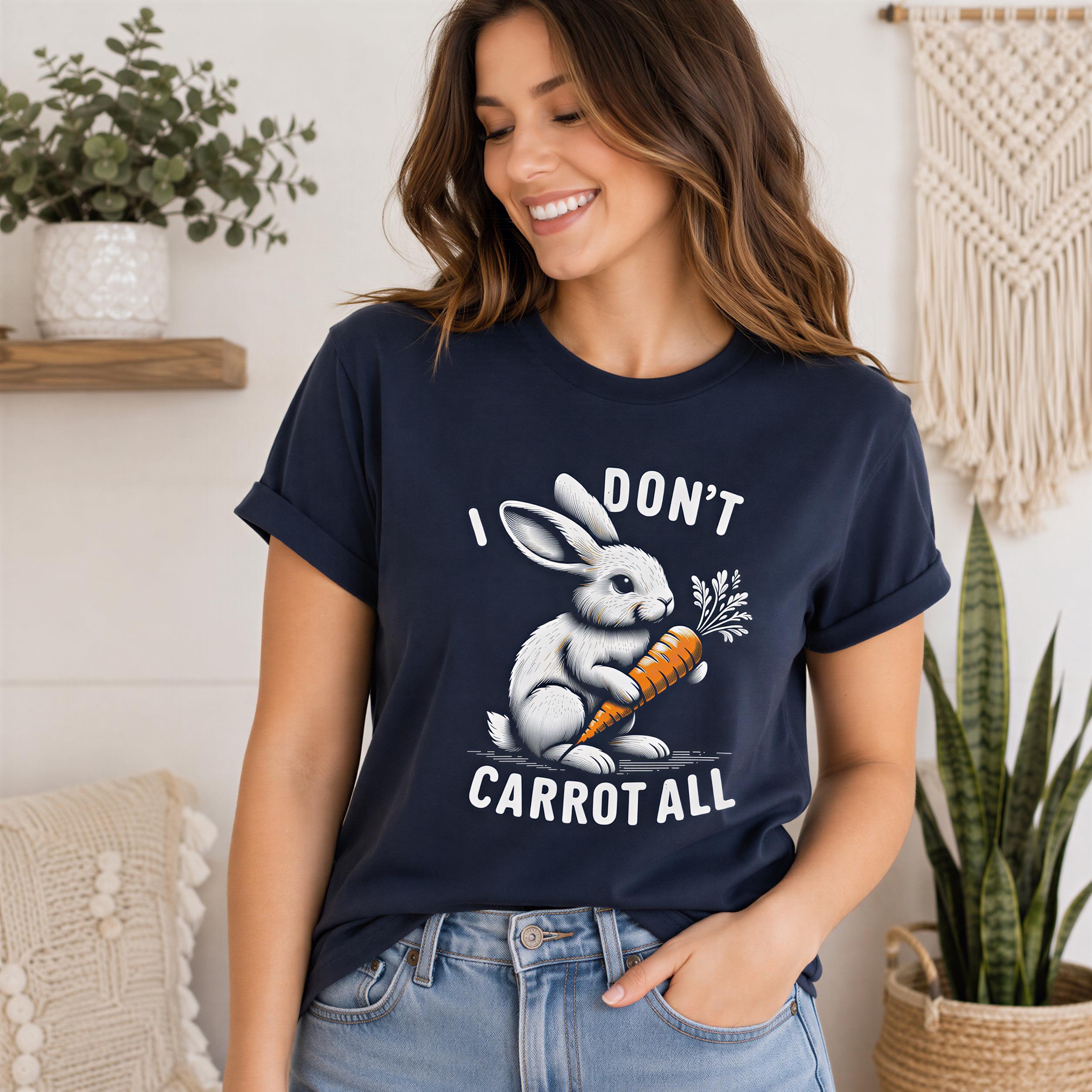 A woman wearing a navy blue t-shirt with a graphic of a rabbit holding a carrot and the text "I DON'T CARROT ALL" printed on it.