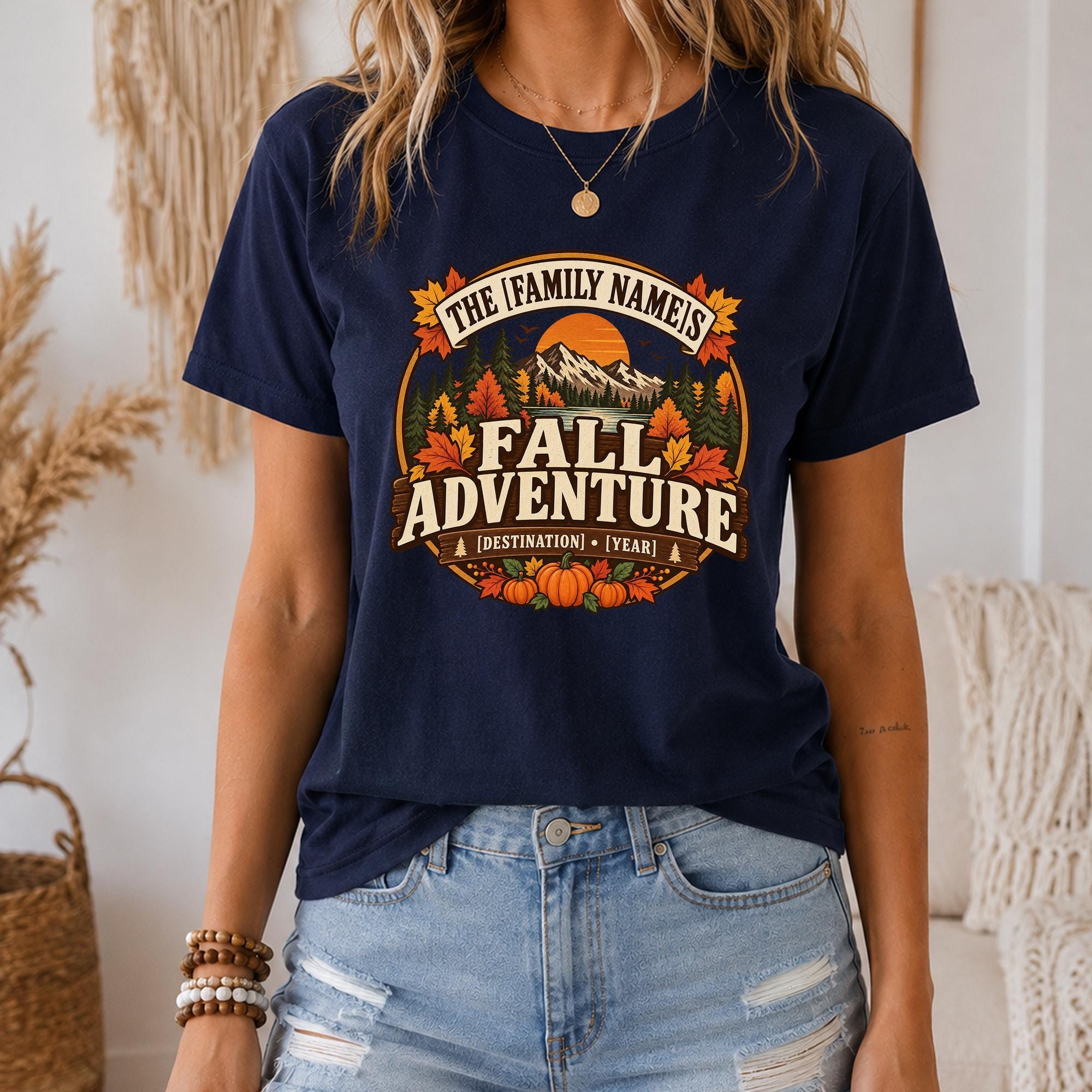 A woman wearing a navy blue t-shirt with a graphic design that says "The family names fall adventure destination year".