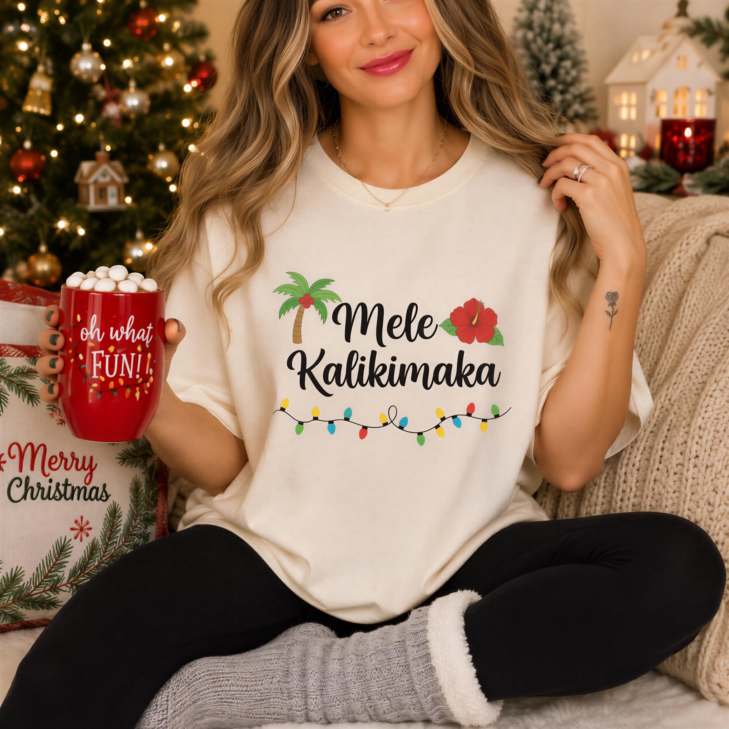 A woman wearing a white t-shirt with a graphic design and text, sitting on a couch with a mug of hot chocolate in her hand.