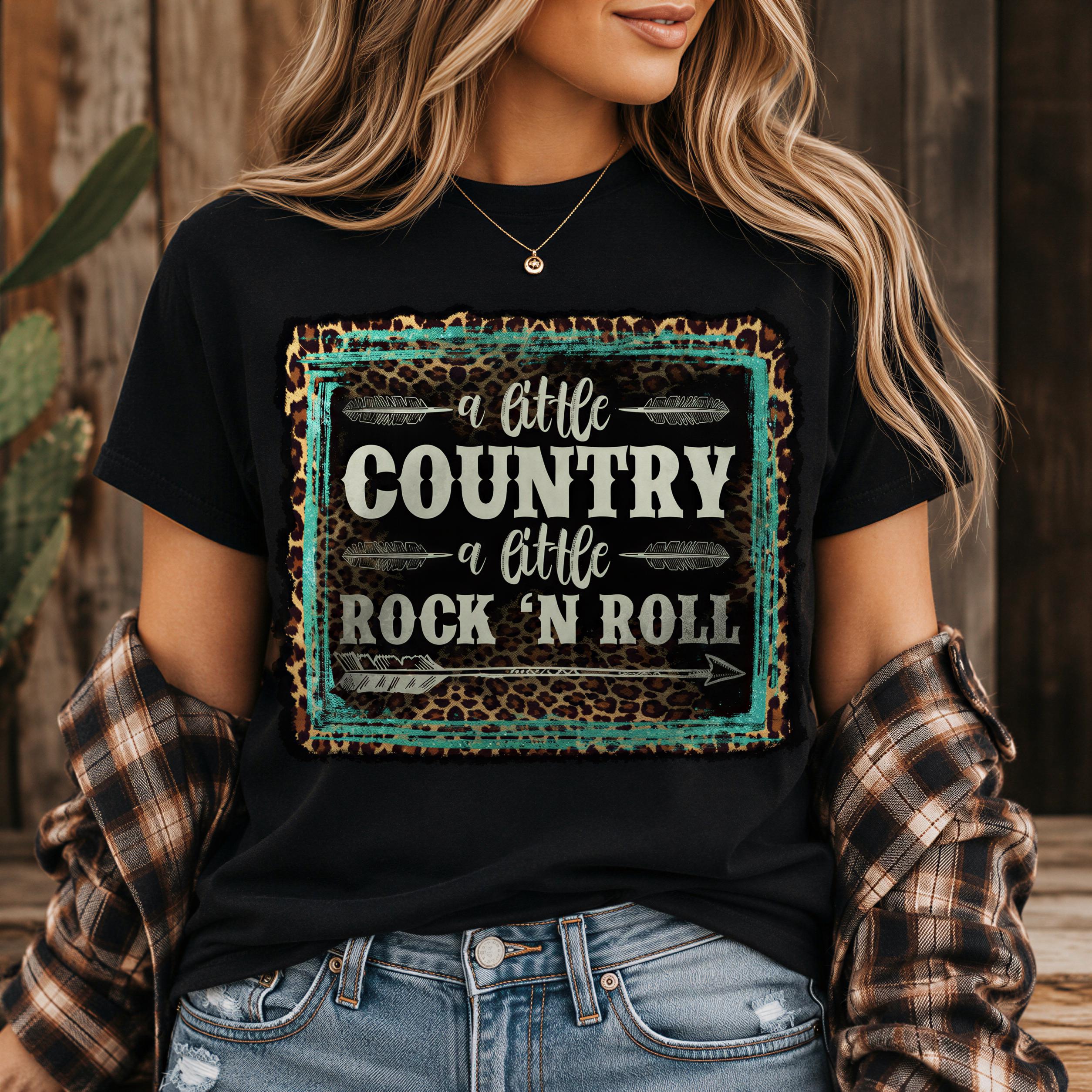 A woman wearing a black t-shirt with a text design that says "a little country a little rock 'n roll" in a cheetah print pattern.