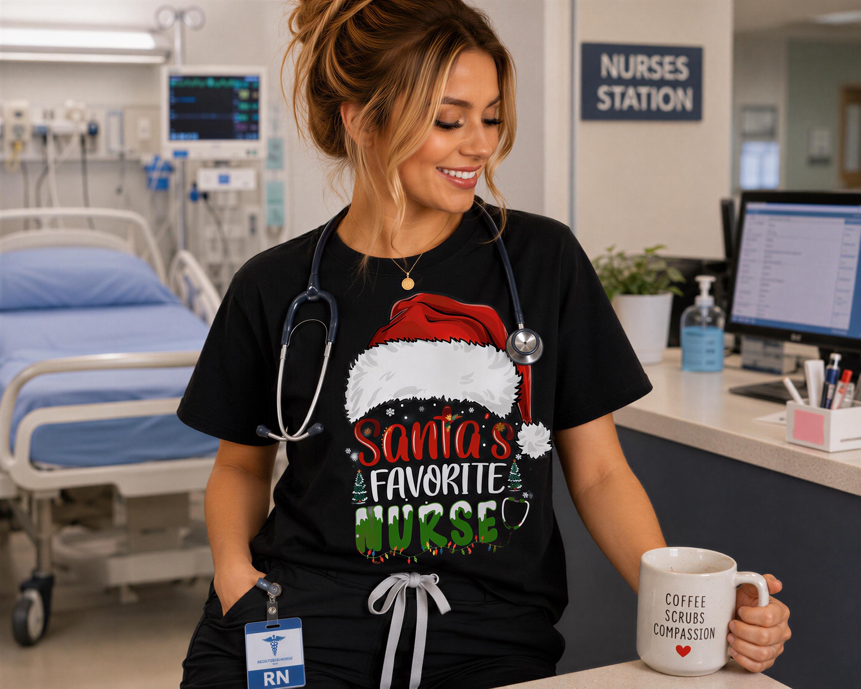 A smiling woman wearing a black t-shirt with a Santa hat and text, holding a coffee mug, in a hospital setting.