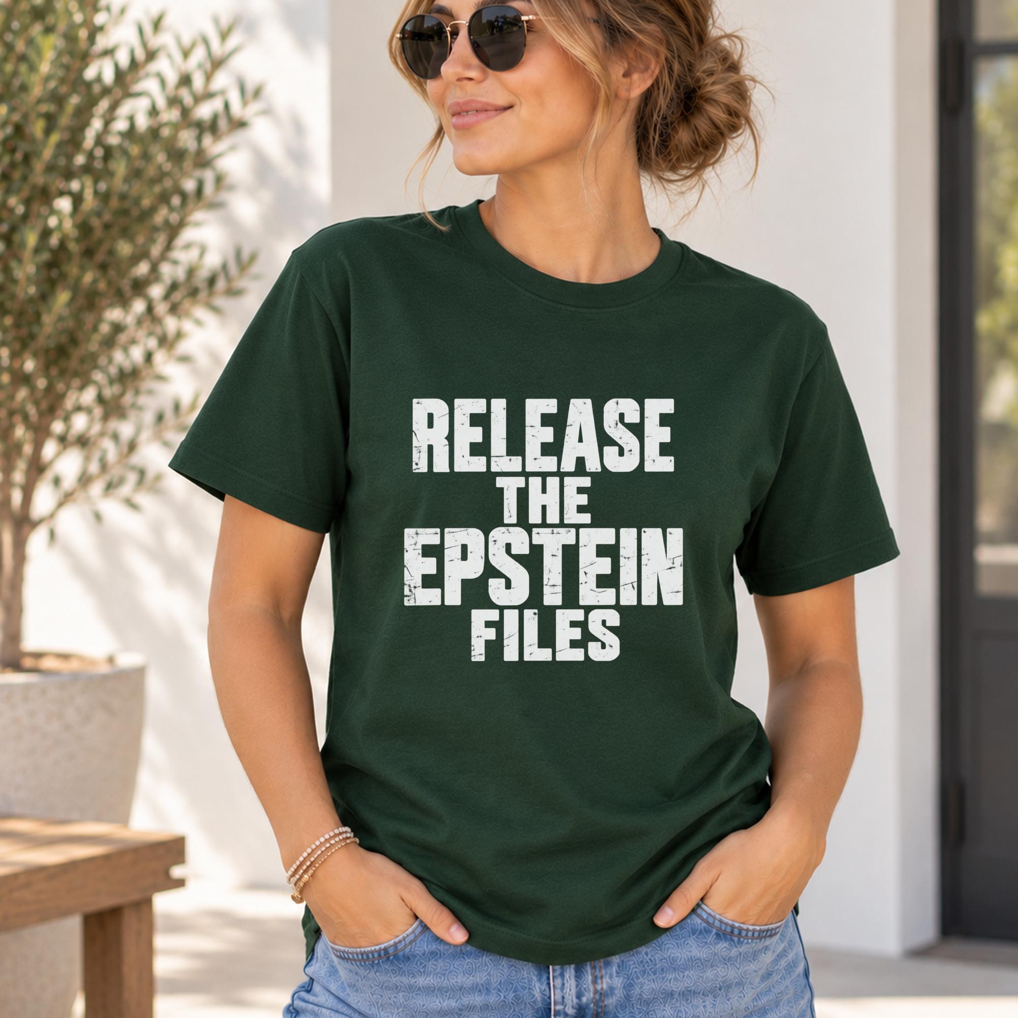 A woman wearing a green t-shirt with the text "RELEASE THE EPSTEIN FILES" printed on it.