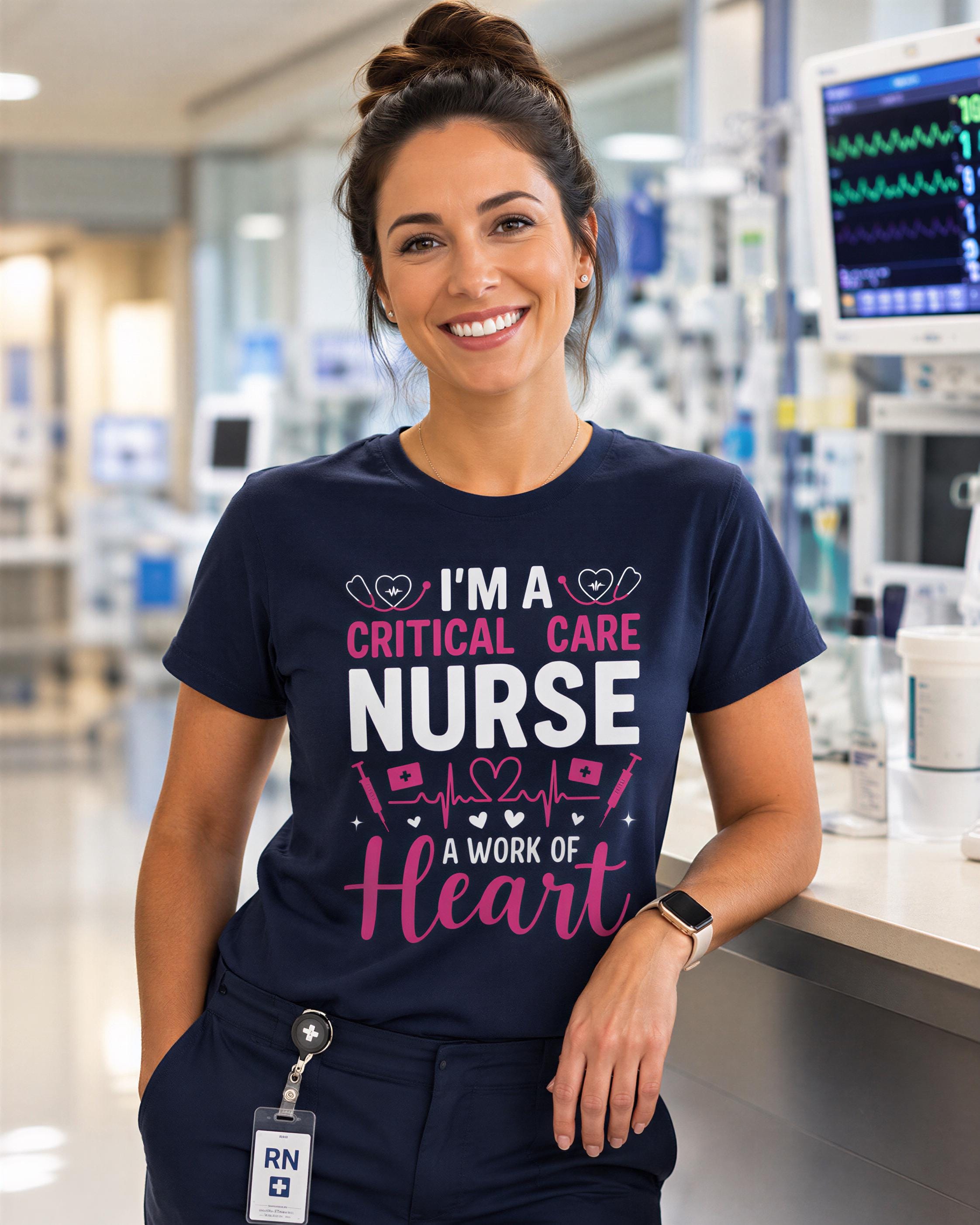 A smiling woman wearing a navy blue t-shirt with text that says "I'm a critical care nurse, a work of heart" and a badge with the letters "RN".