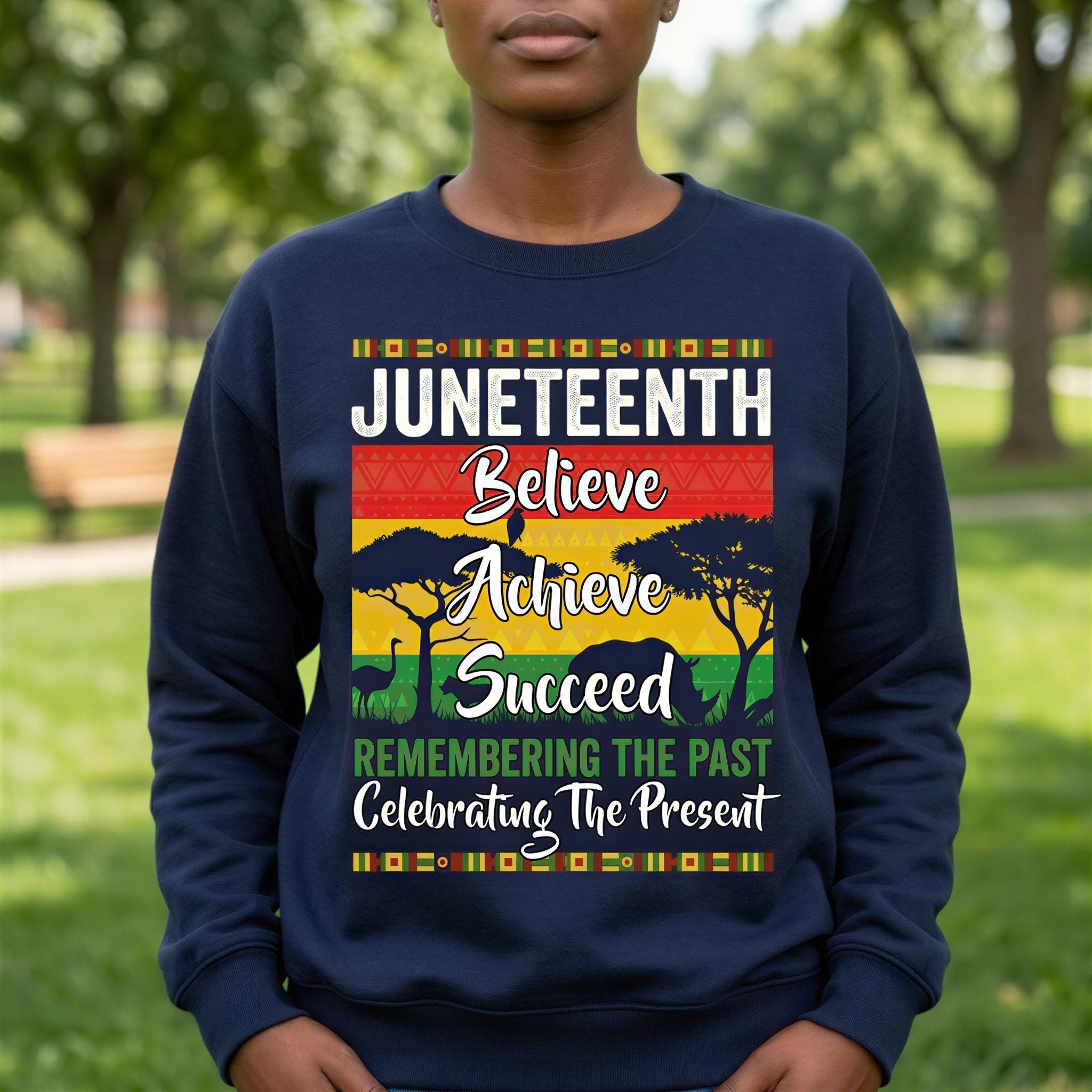 A person wearing a navy blue sweatshirt with a graphic design featuring text and a tree silhouette.