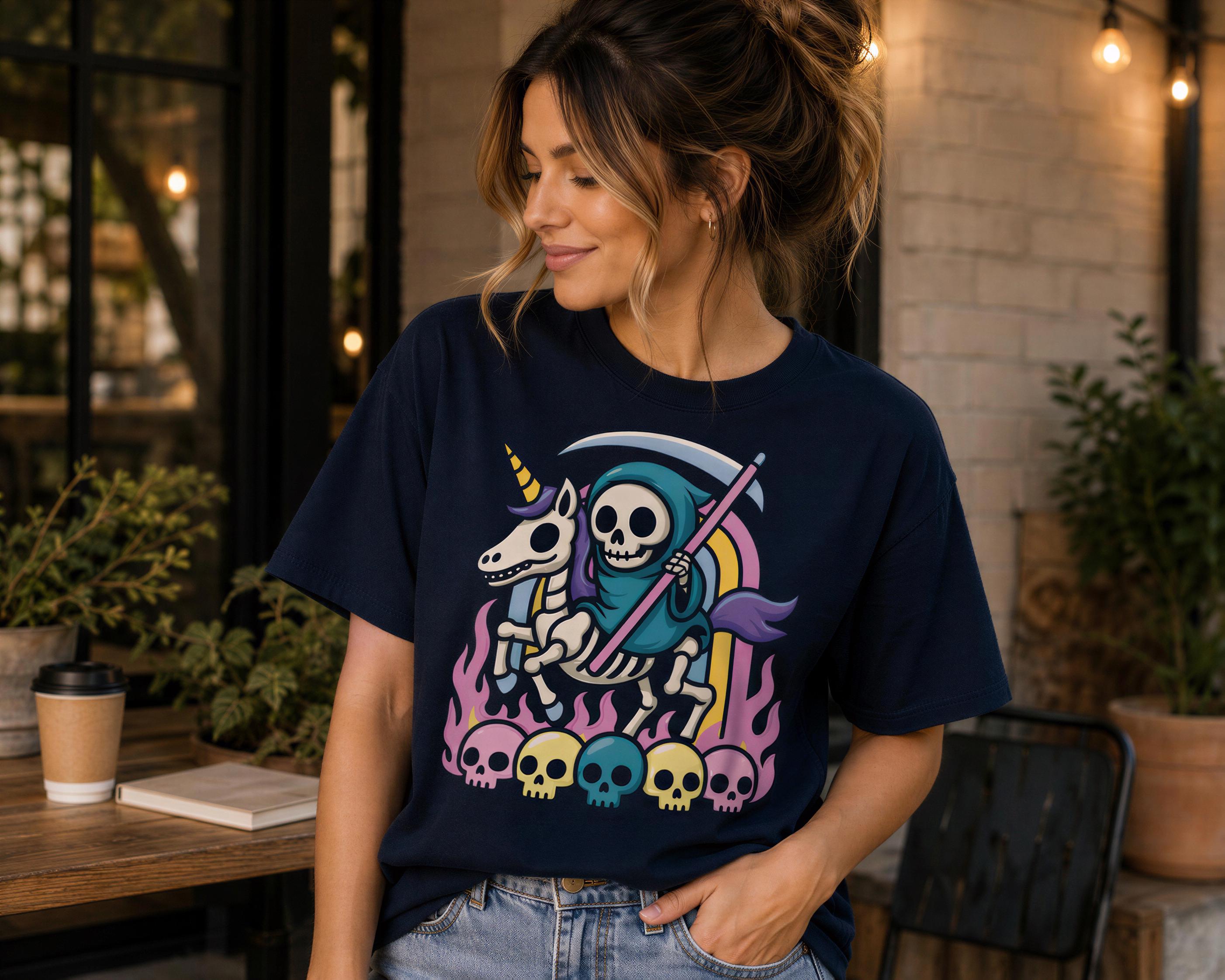 A woman wearing a black t-shirt with a graphic design of a skeleton riding a unicorn and holding a staff, surrounded by skulls and flames.