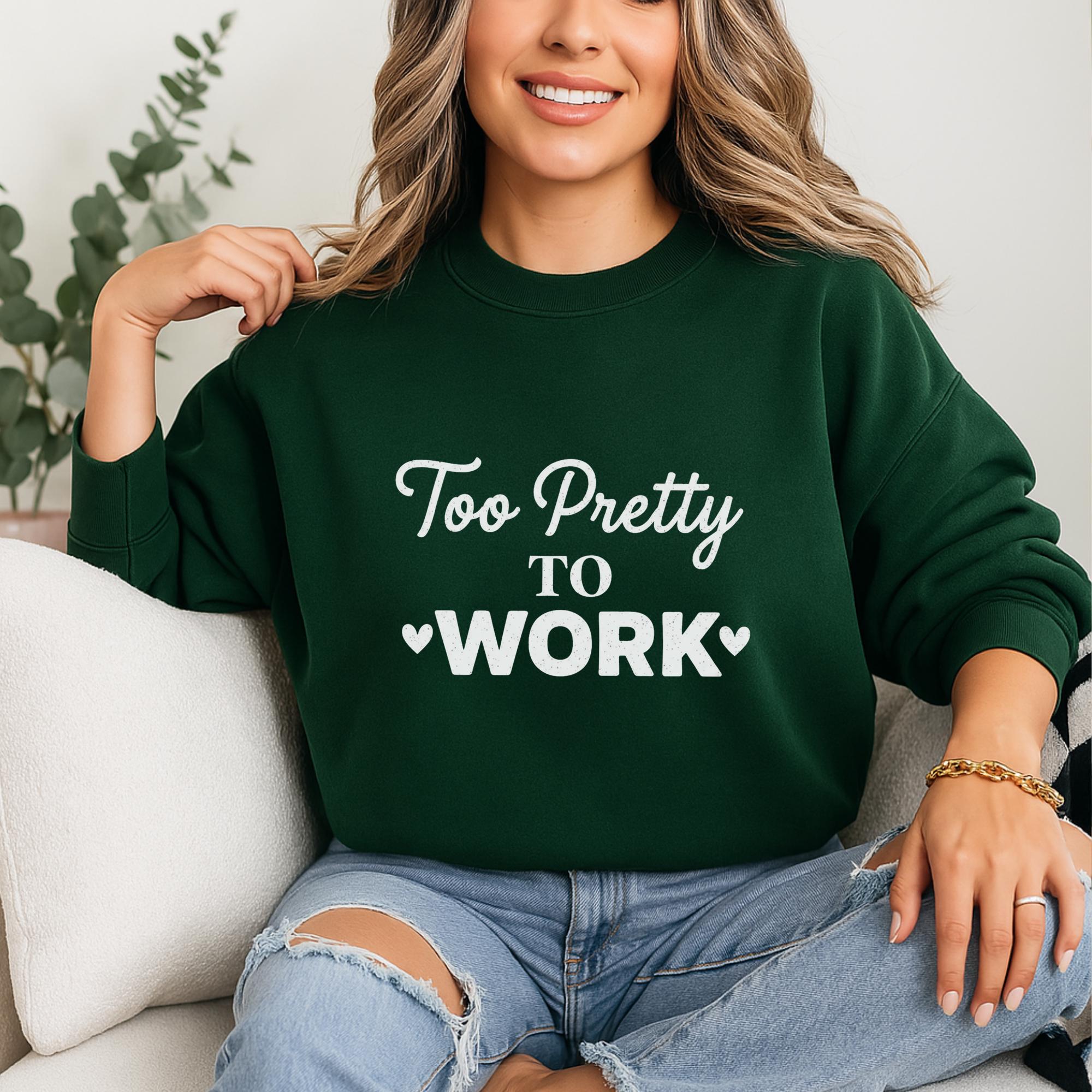 A woman wearing a green sweatshirt with the text "Too Pretty to Work" is sitting on a couch.