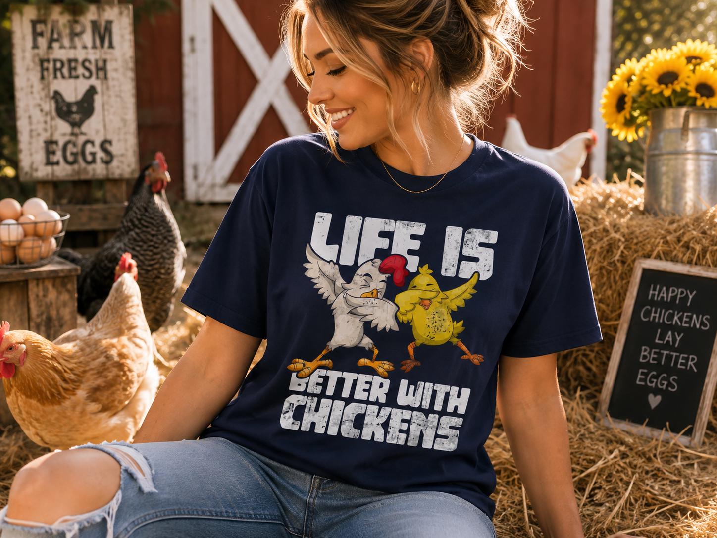 A woman wearing a blue t-shirt with a cartoon chicken and the text "Life is better with chickens" is sitting on hay bales surrounded by chickens.