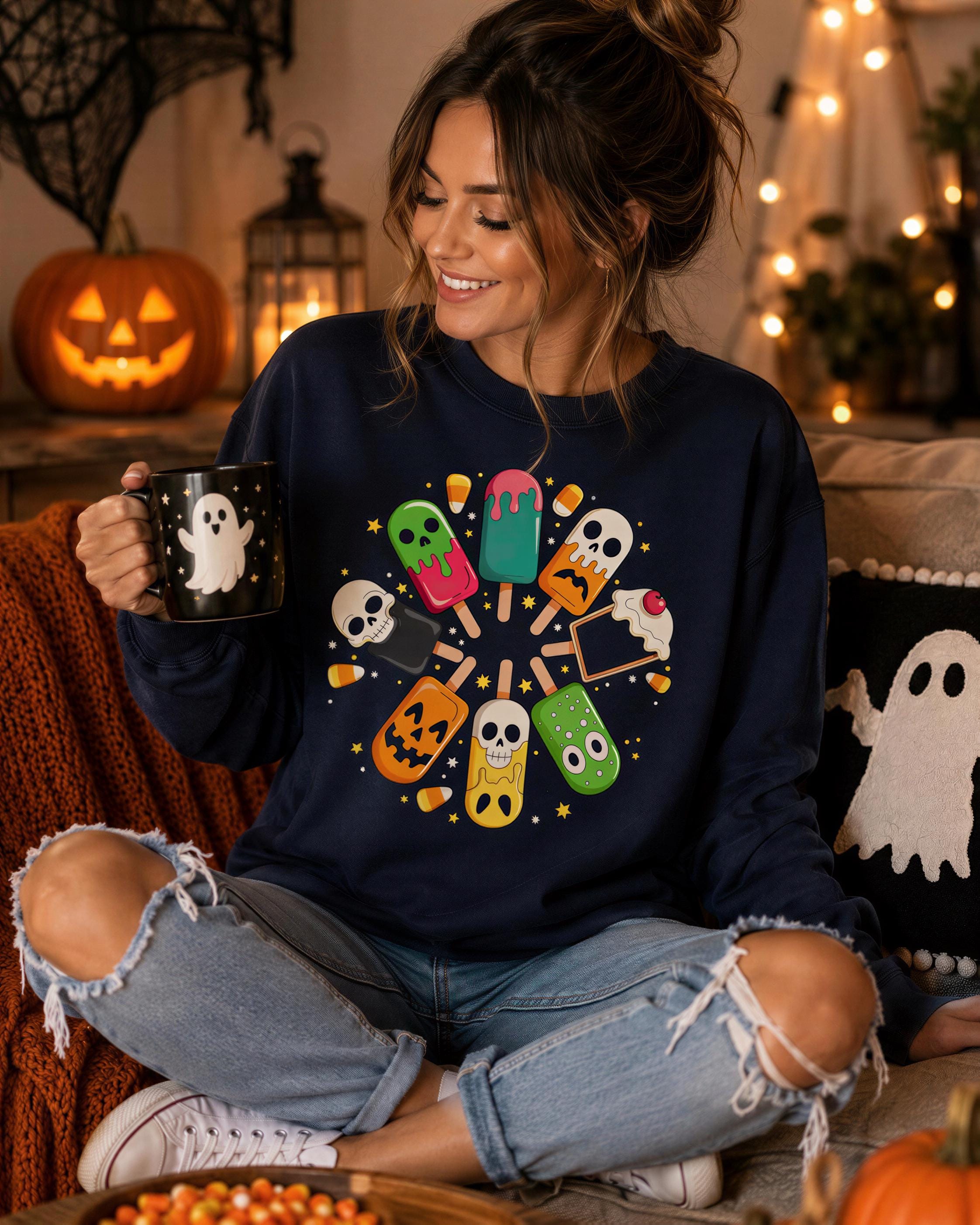 A woman is sitting on a couch, holding a mug with a Halloween-themed design, surrounded by Halloween decorations and a jack-o-lantern.
