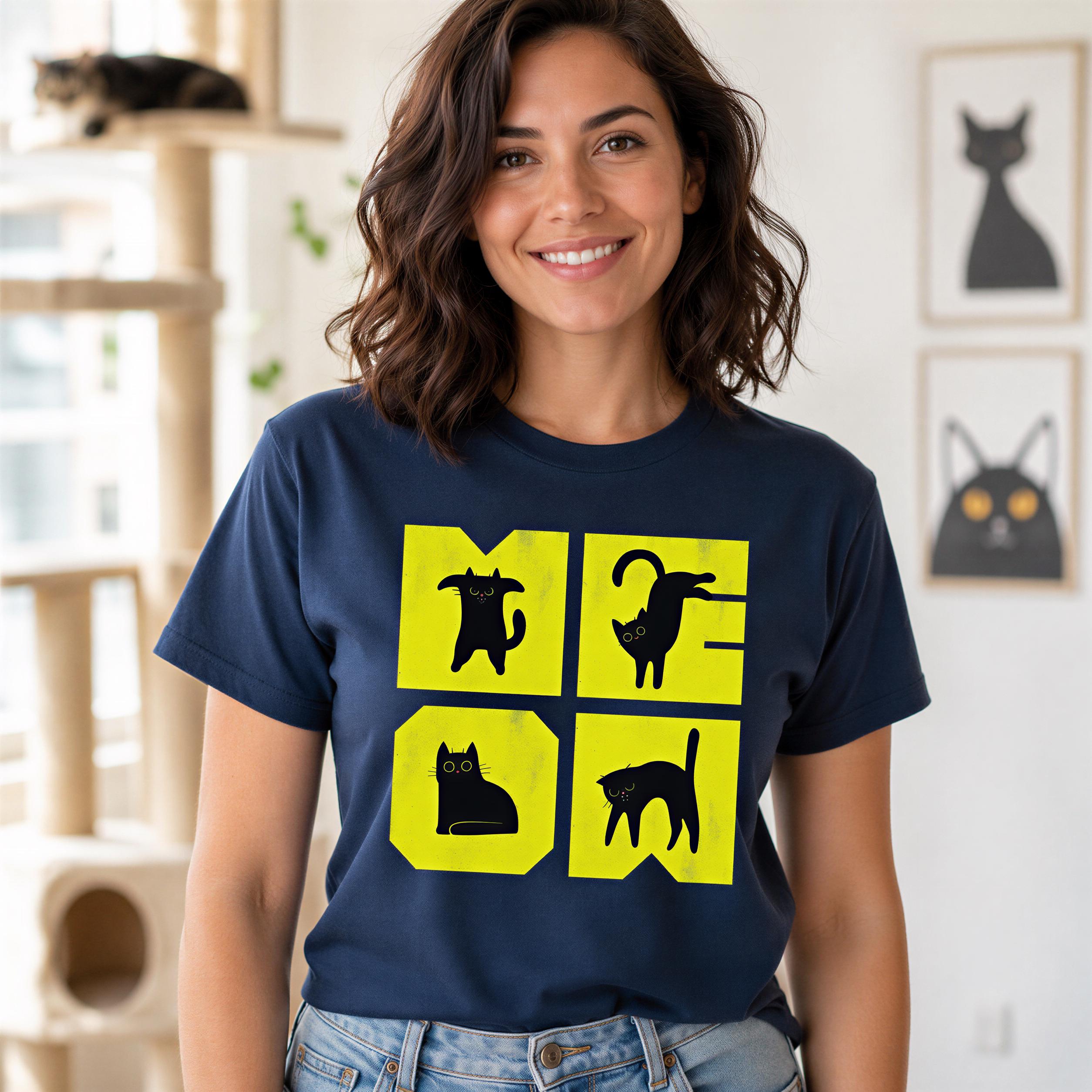 A woman wearing a navy blue t-shirt with a graphic design of four cat silhouettes in yellow squares.