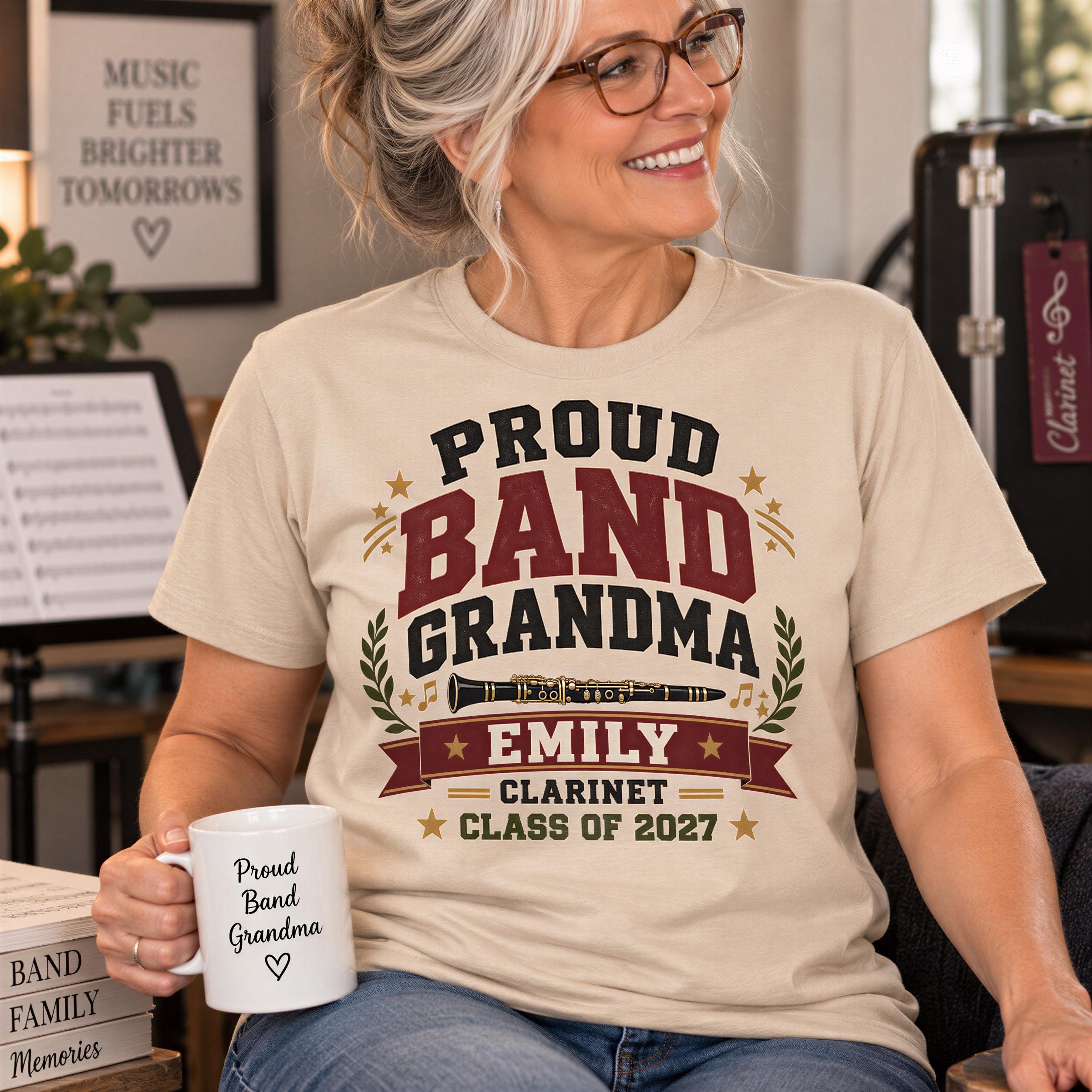 A smiling woman wearing a t-shirt with text and a musical instrument graphic, holding a white mug with text printed on it.