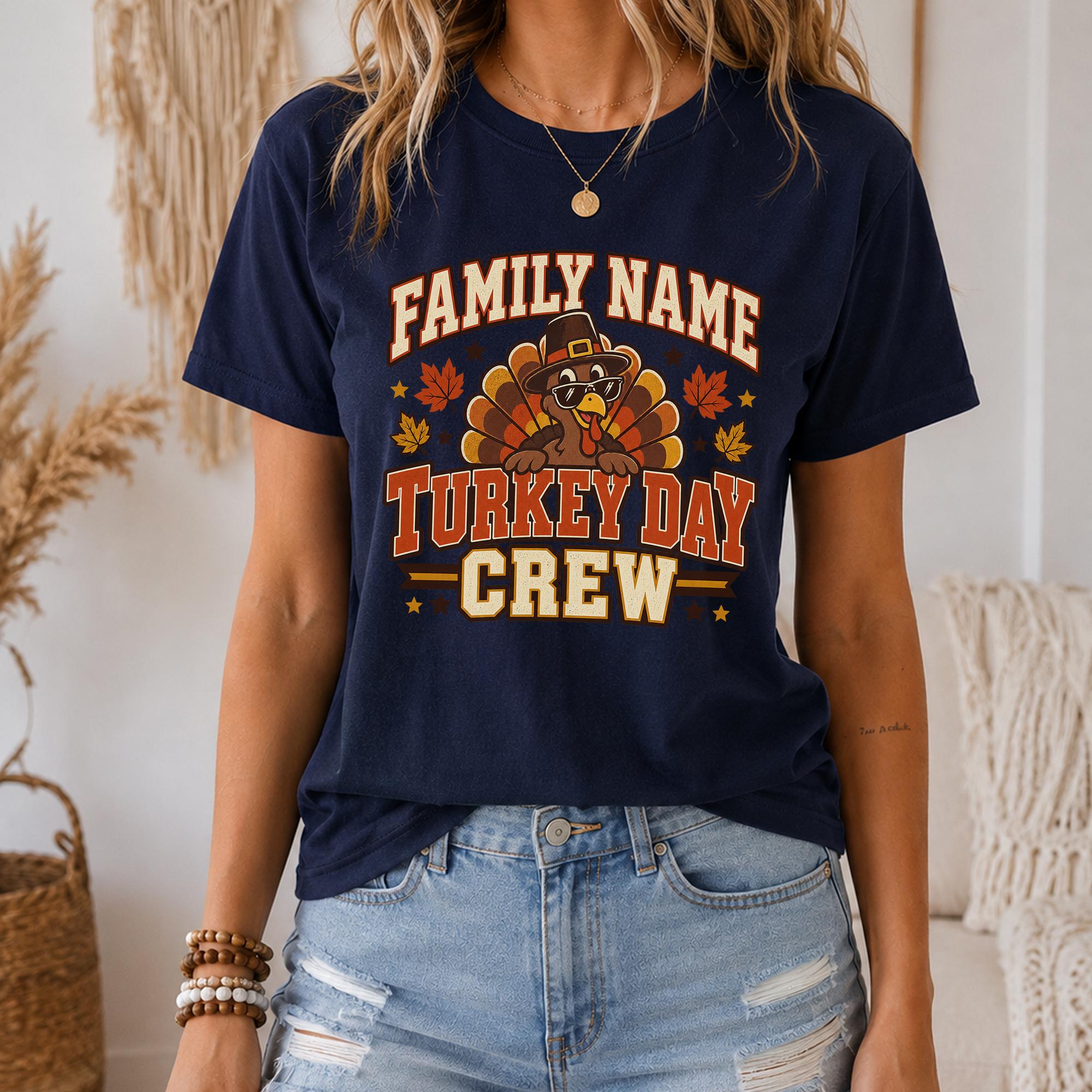 A woman wearing a navy blue t-shirt with a turkey graphic and text that says "Family Name Turkey Day Crew".