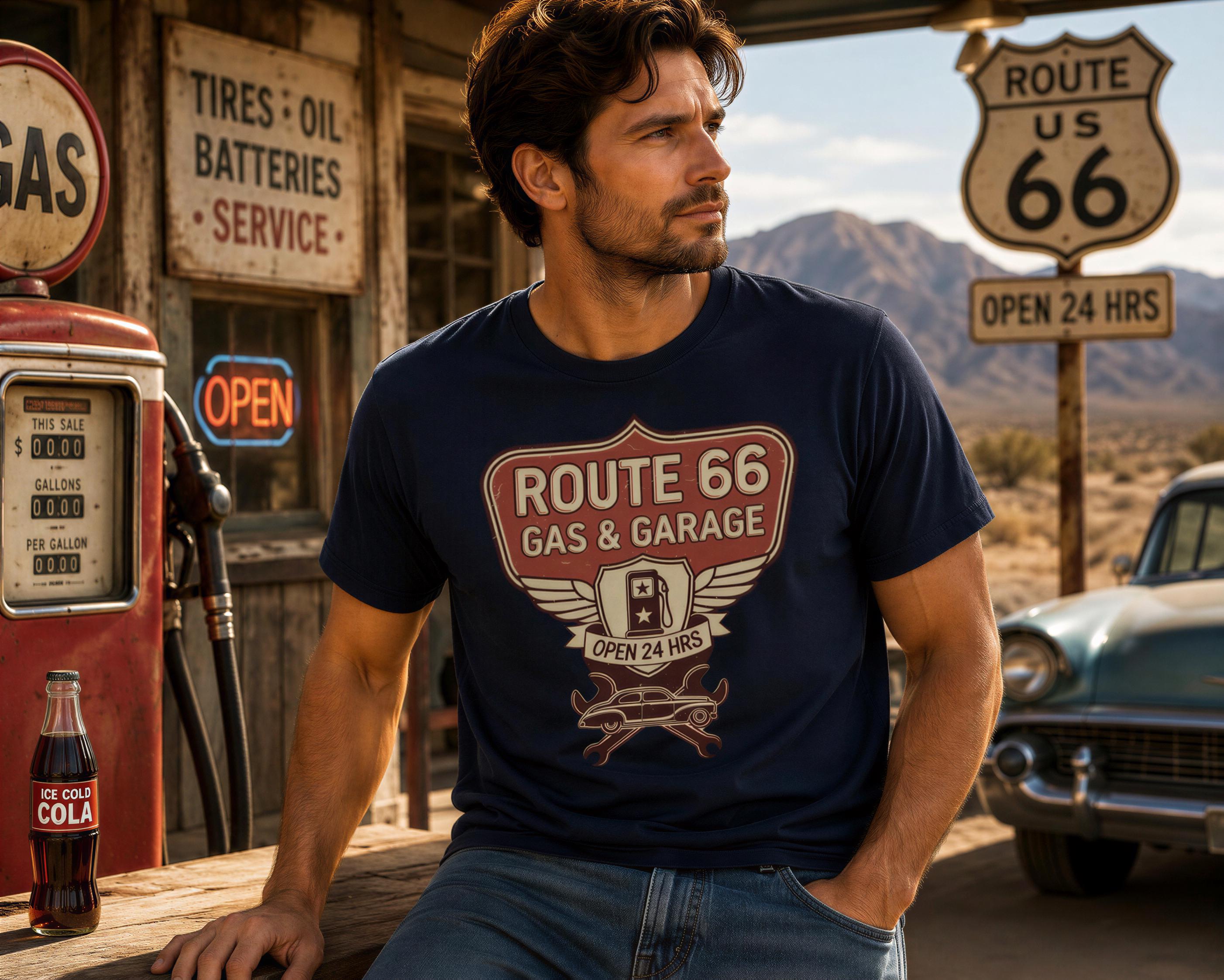 A man in a navy blue t-shirt with Route 66 printed on it is sitting at a gas station, with a vintage car and a sign for Route 66 visible in the background.