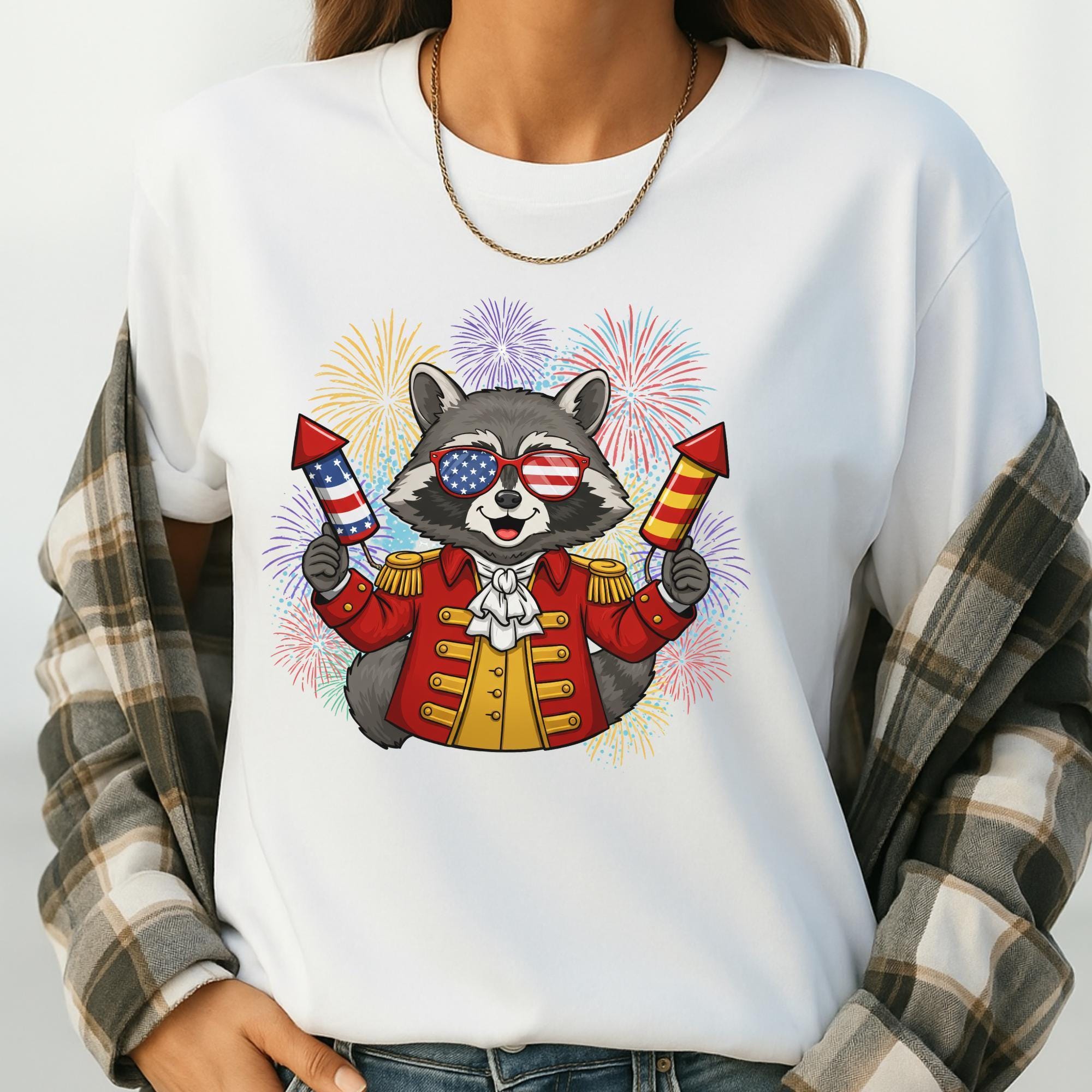 A person wearing a white t-shirt with a graphic of a raccoon holding fireworks and wearing sunglasses.