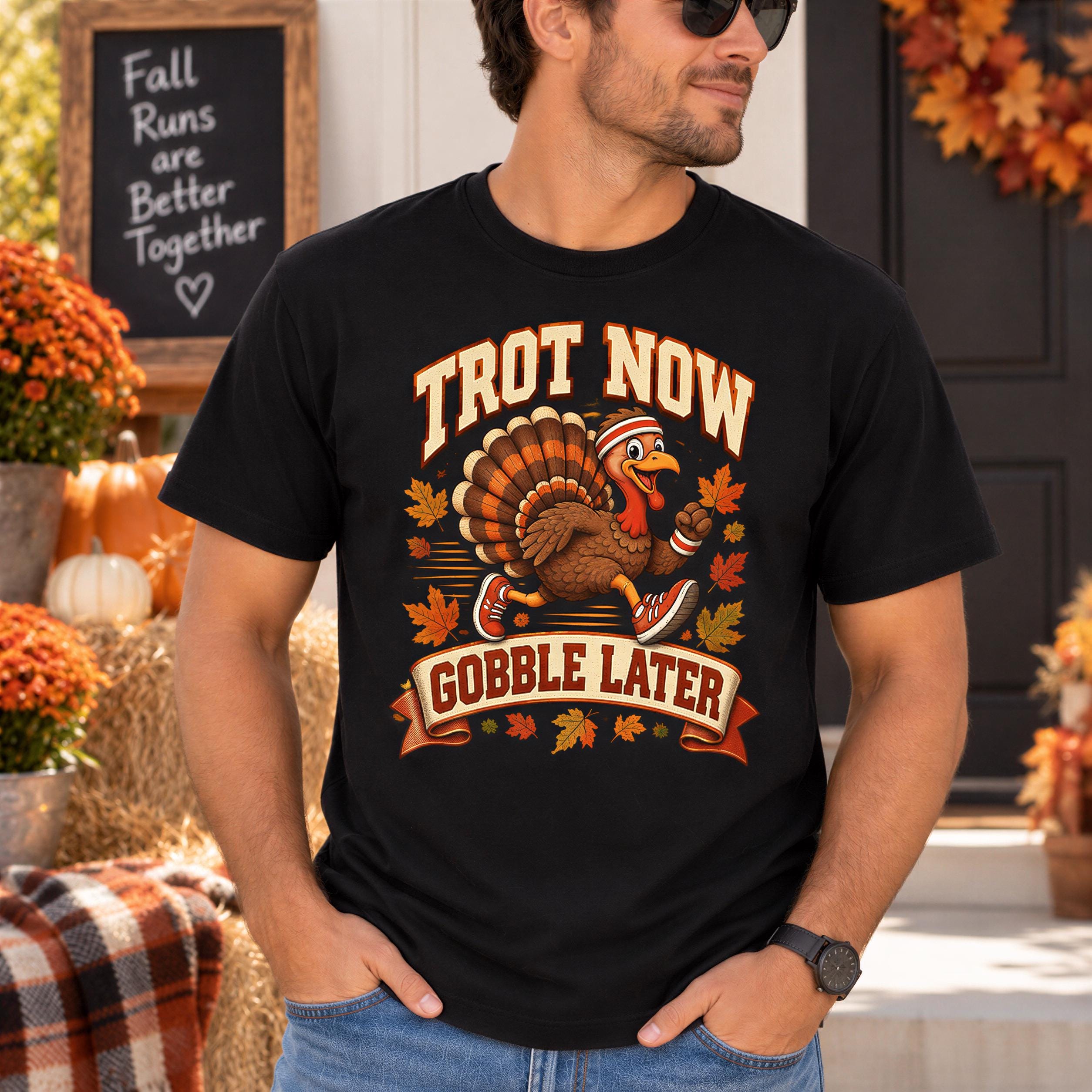 A man wearing a black t-shirt with a graphic of a turkey and the text "TROT NOW GOBBLE LATER" is standing in front of a chalkboard sign that says "Fall Runs are Better Together".