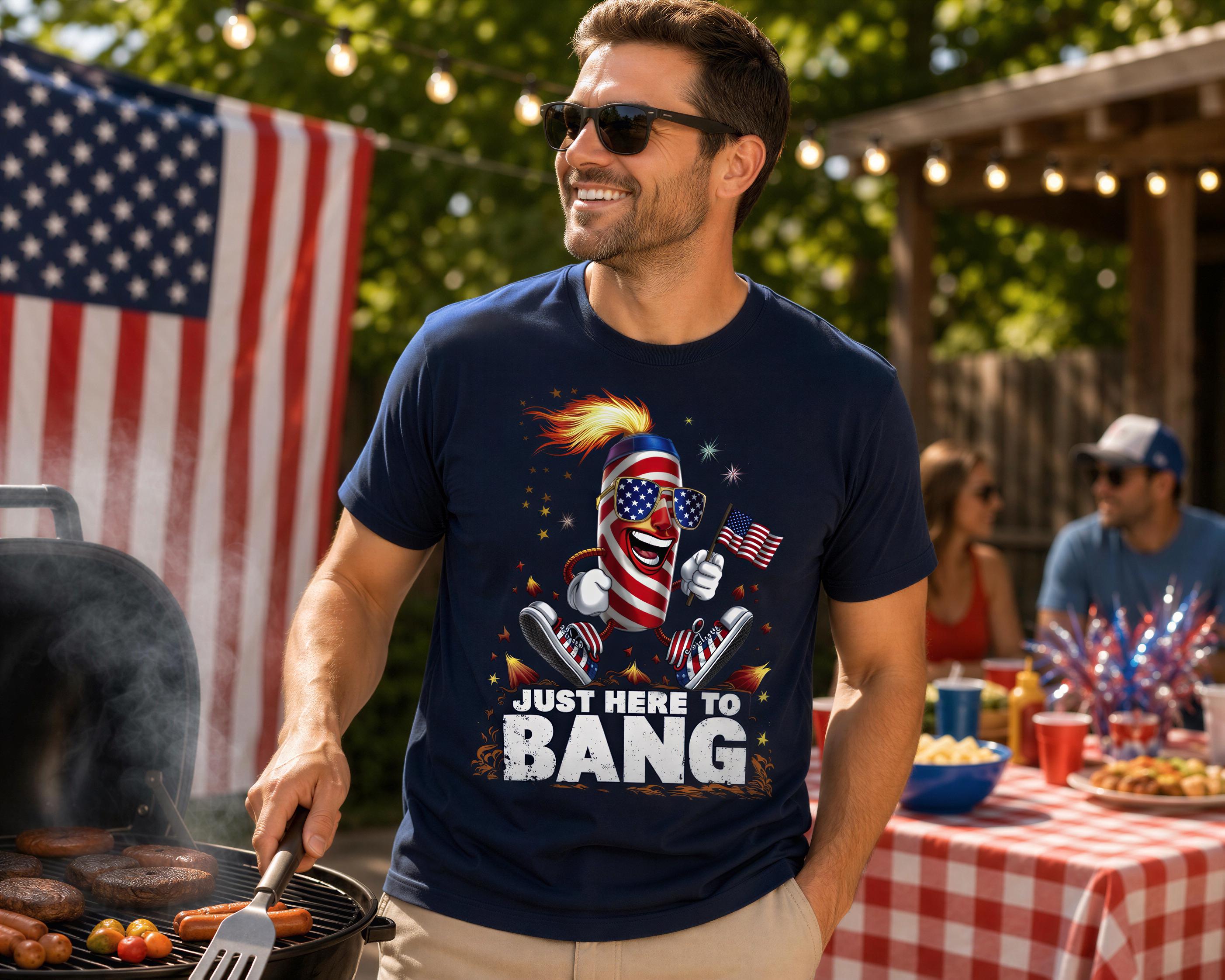 A man wearing a blue t-shirt with an American flag design and sunglasses is grilling food outdoors.
