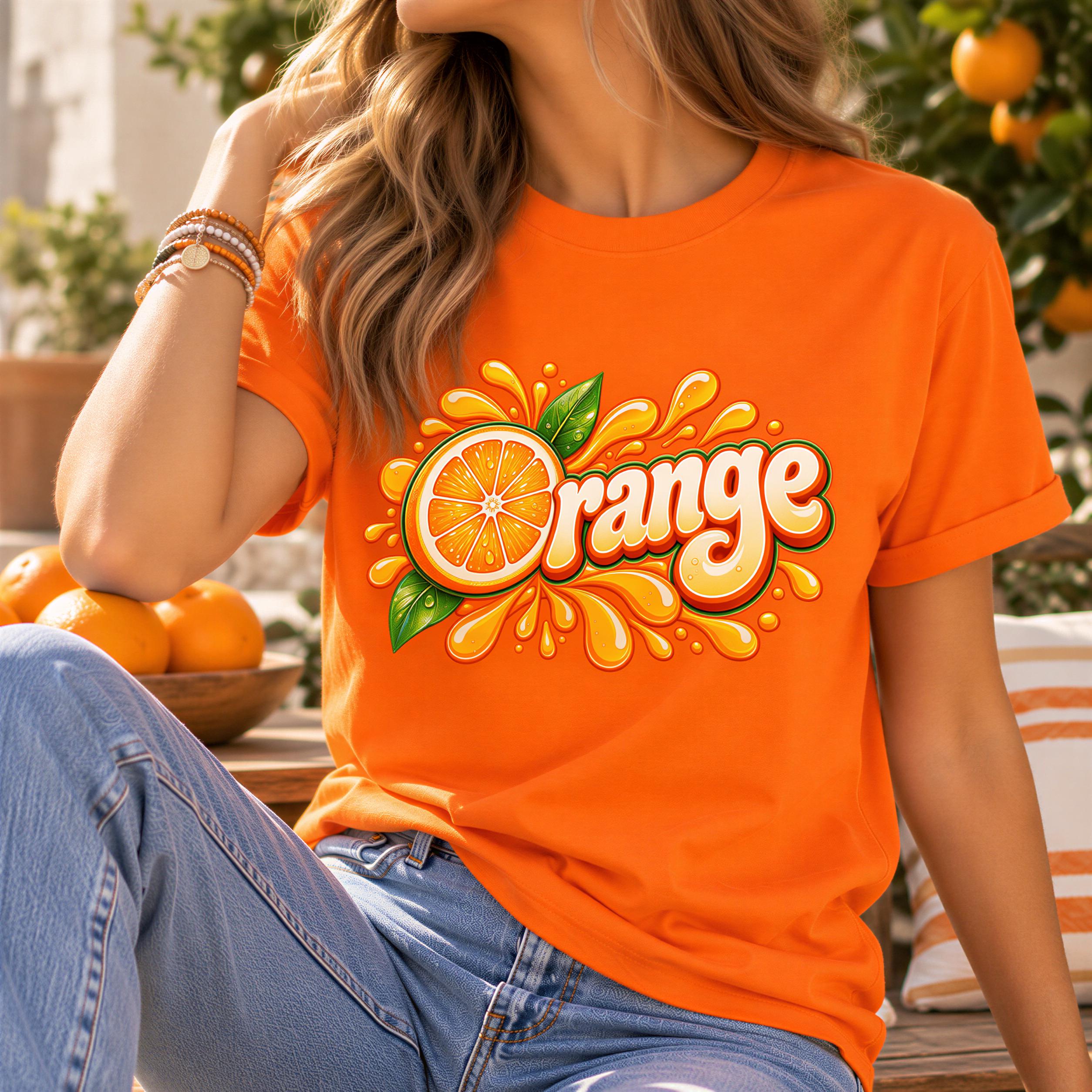 A woman wearing an orange t-shirt with a graphic of an orange and splashes of orange juice.