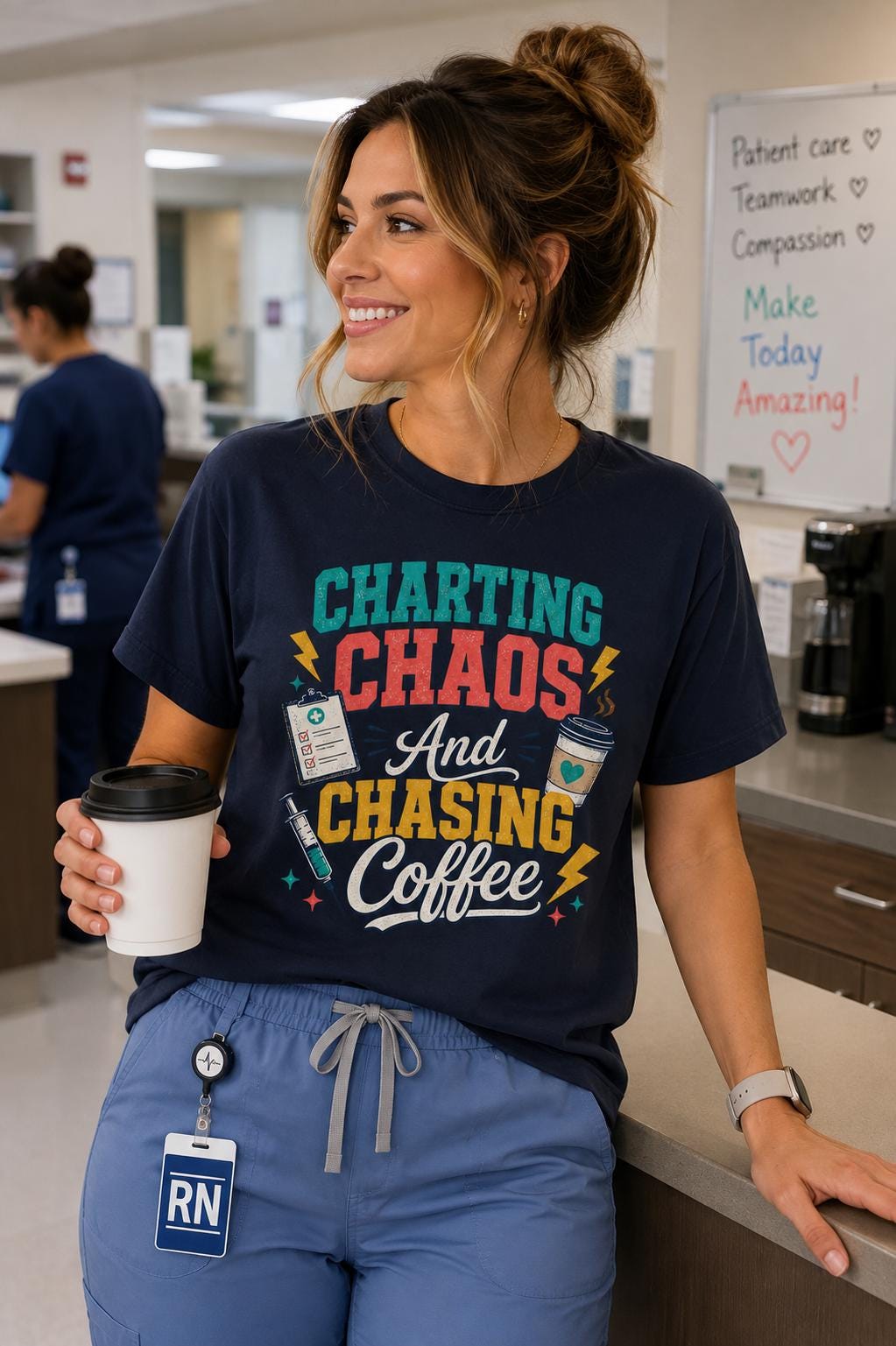 A smiling woman wearing a black t-shirt with a colorful graphic design and holding a coffee cup, standing in a room with a whiteboard and other medical equipment in the background.