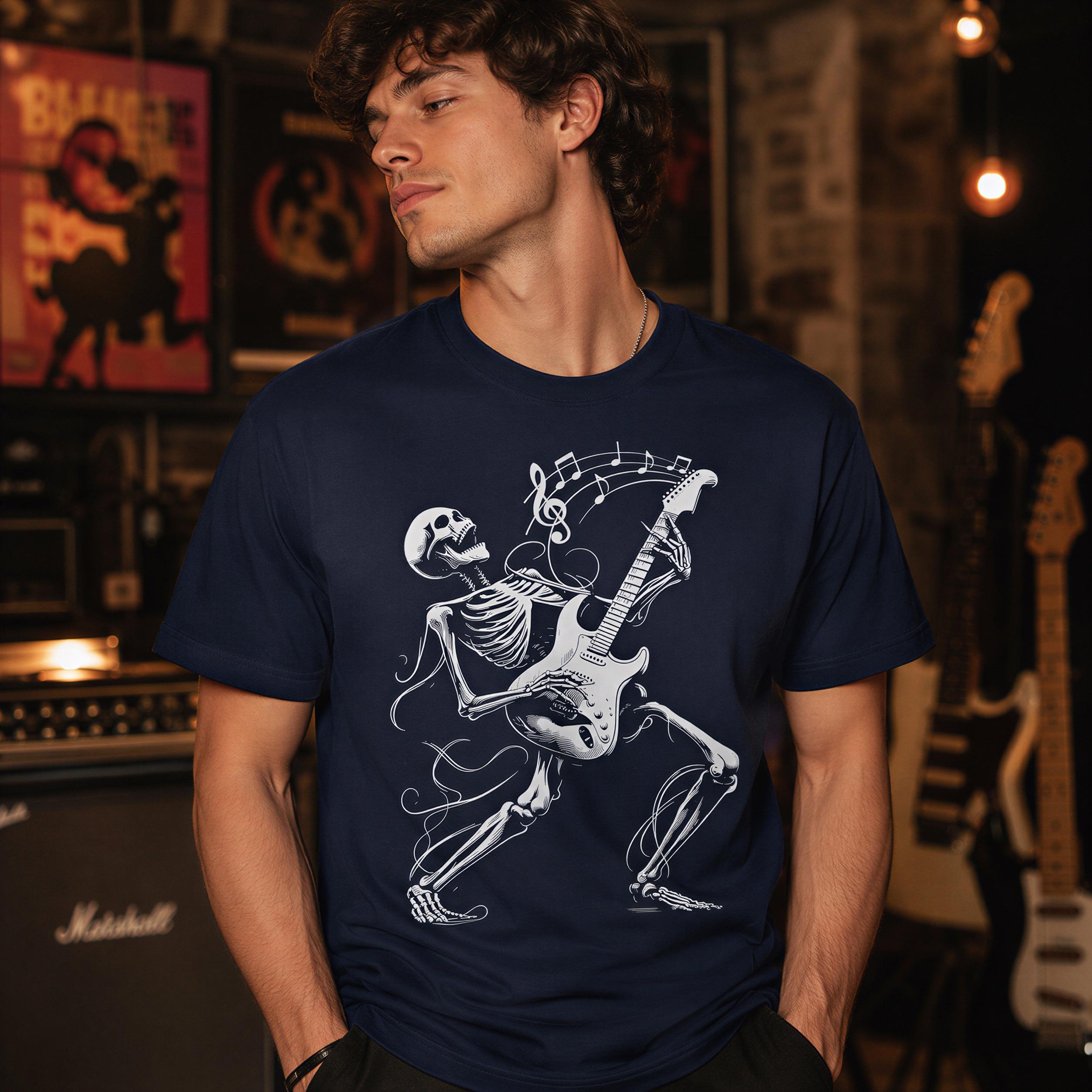 A man wearing a navy blue t-shirt with a white graphic of a skeleton playing a guitar.
