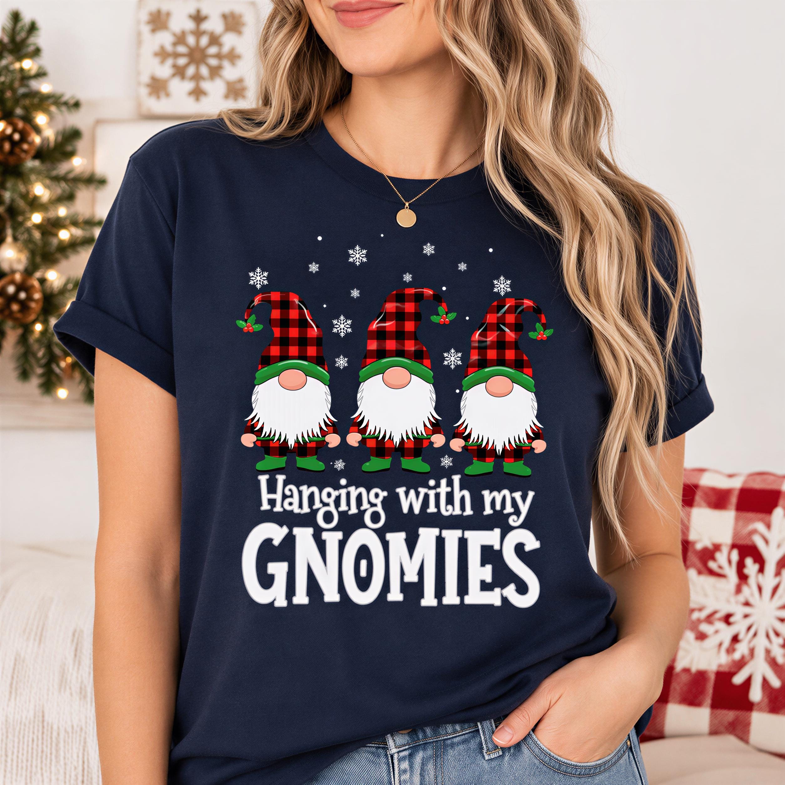 A woman wearing a navy blue t-shirt with a graphic design of three gnomes and the text "Hanging with my gnomes".