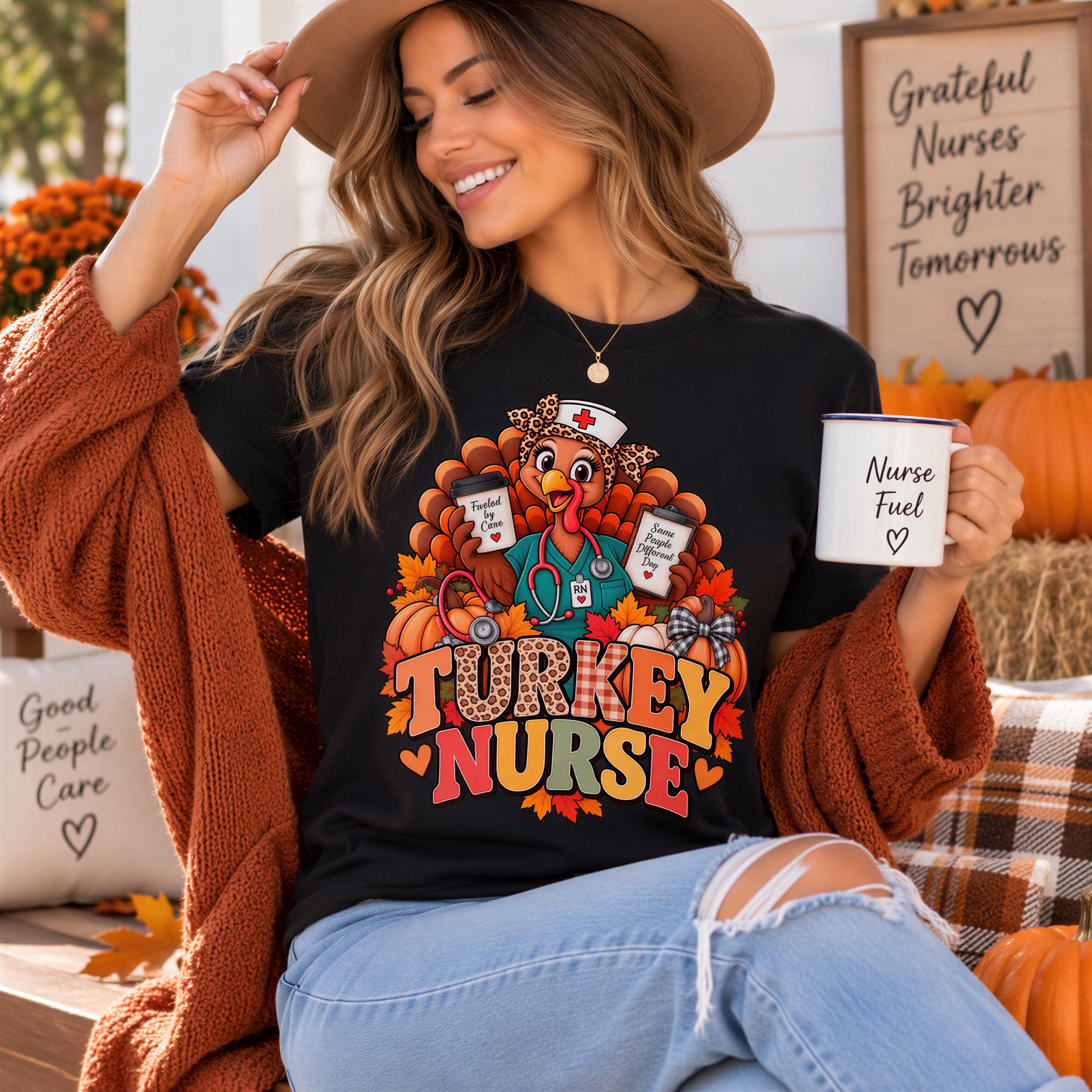 A woman wearing a black t-shirt with a turkey nurse graphic and holding a coffee mug, smiling and sitting outdoors with a pumpkin decoration in the background.