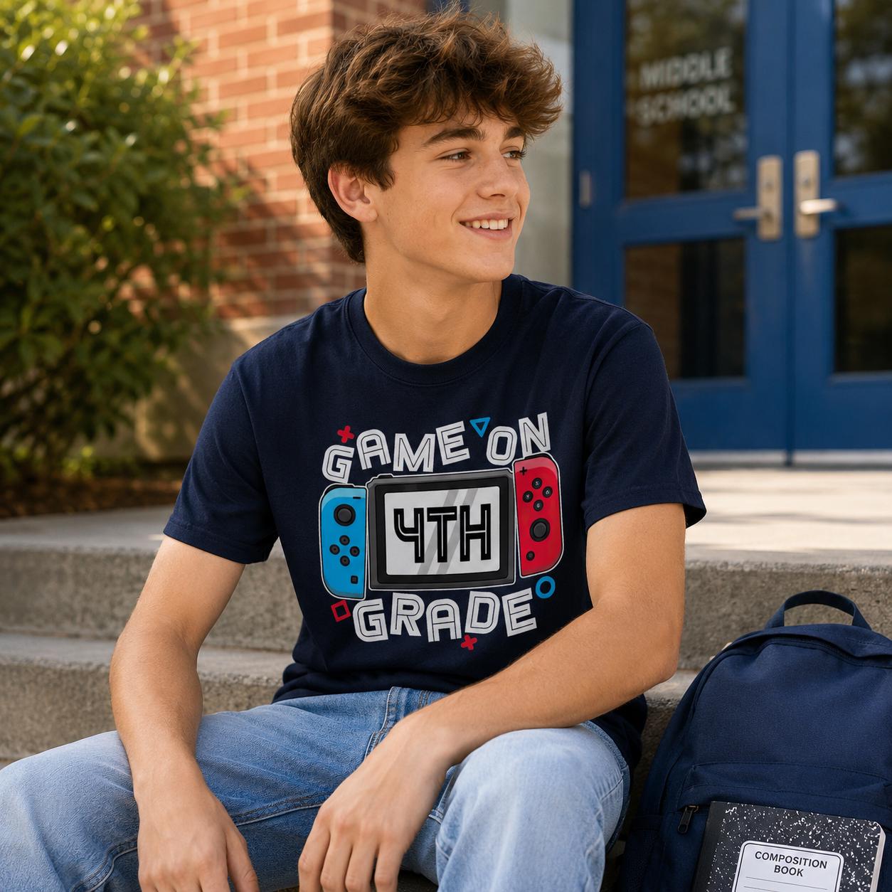 A young man wearing a navy blue t-shirt with a graphic design sitting on steps in front of a school building.