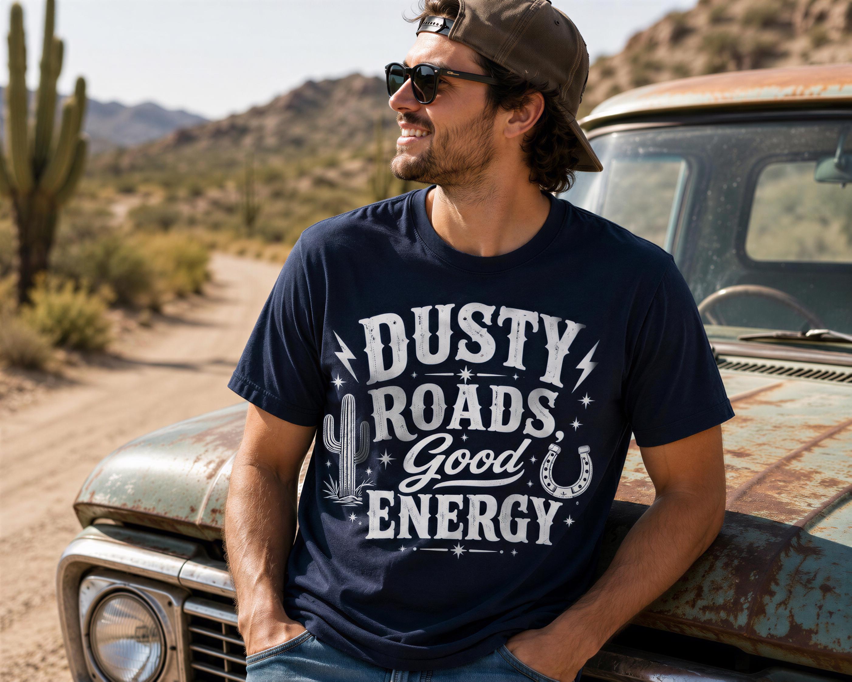 A man wearing sunglasses and a hat leans against an old, rusted truck in a desert landscape.