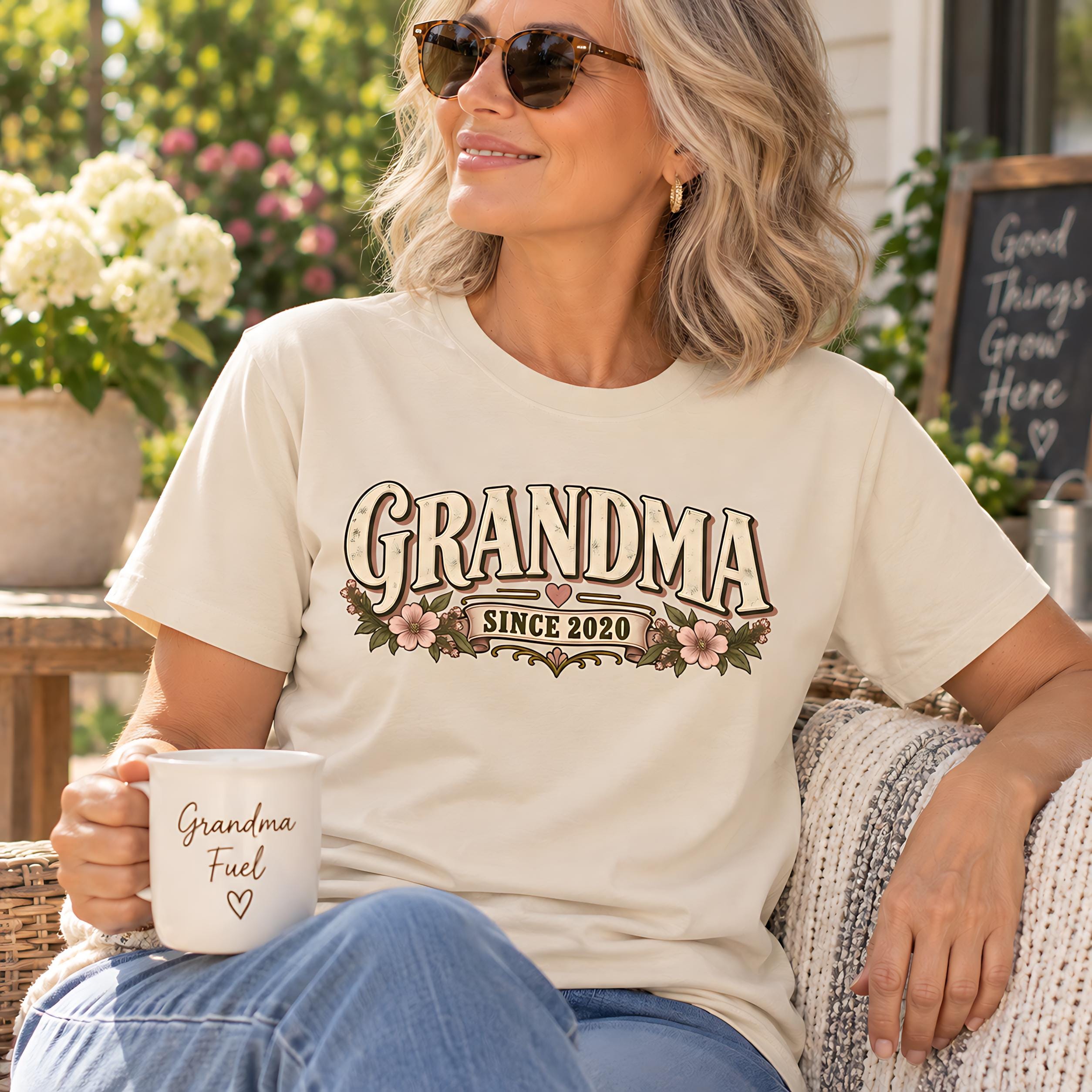 A woman wearing sunglasses and a t-shirt with the text "GRANDMA SINCE 2020" is sitting on a chair, holding a coffee mug with the text "Grandma Fuel" printed on it.