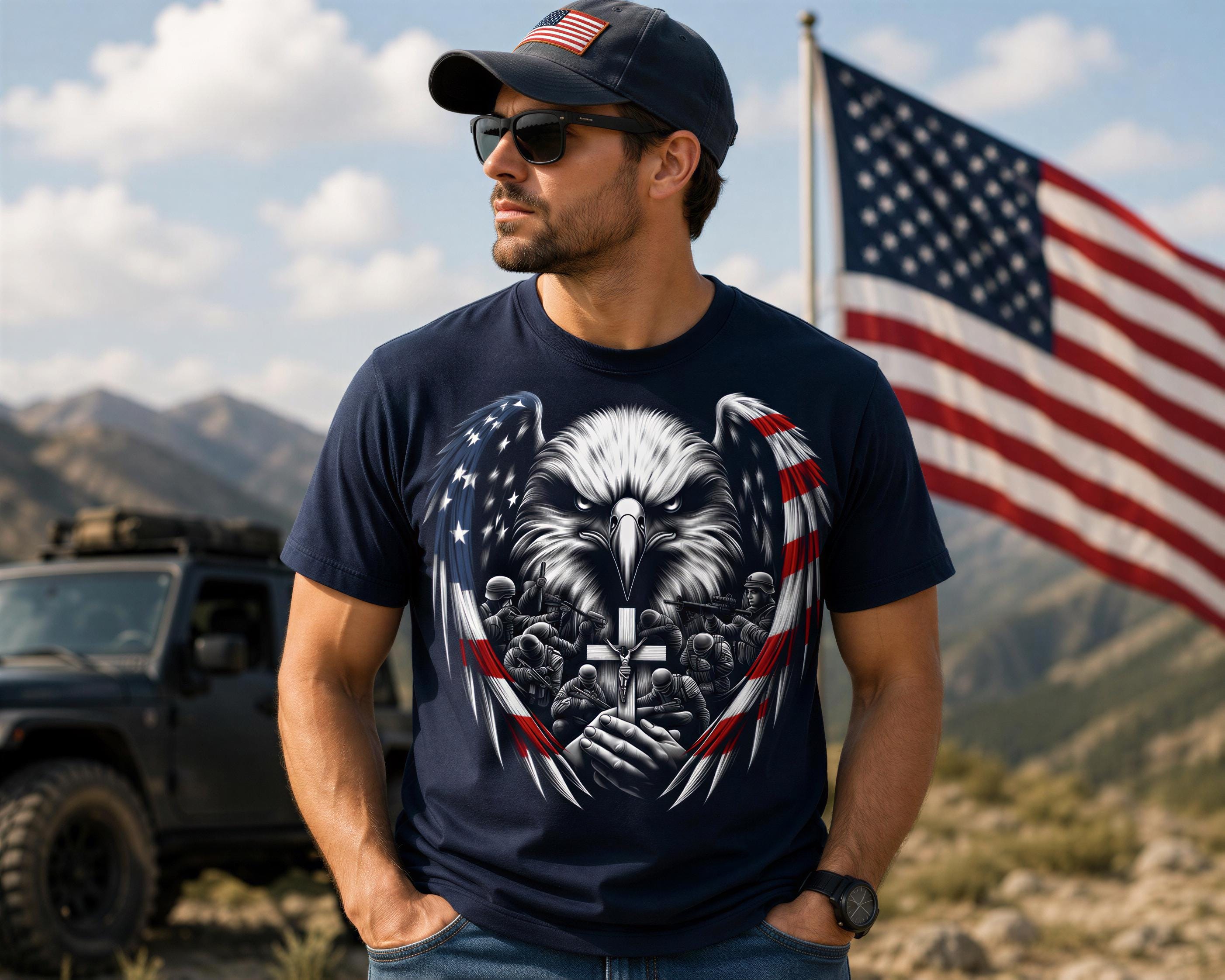A man wearing a black t-shirt with an eagle design and sunglasses stands in front of an American flag, with a jeep visible in the background.