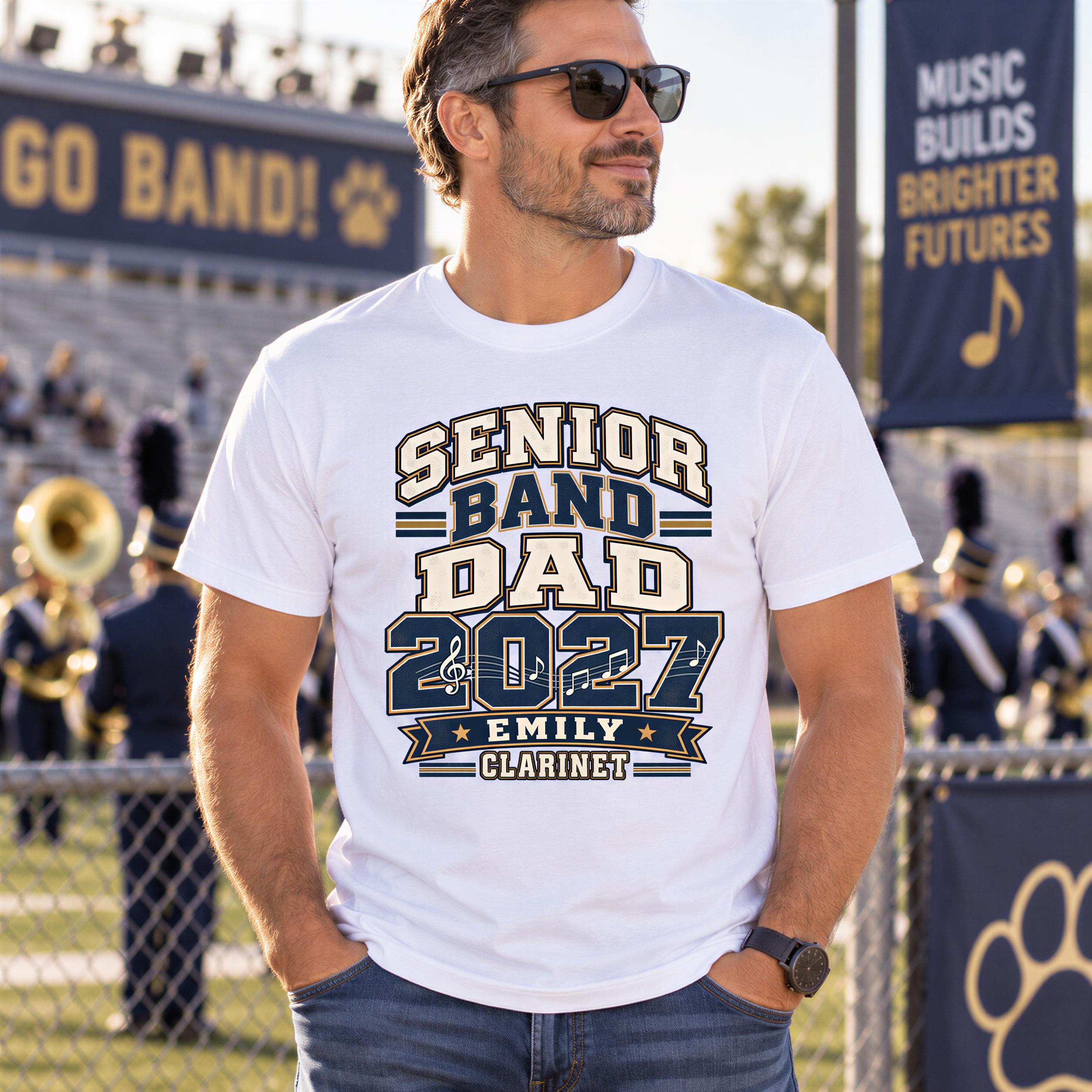 A man wearing a white t-shirt with a graphic design stands in front of a marching band, with a banner that reads "Music Builds Brighter Futures" behind him.