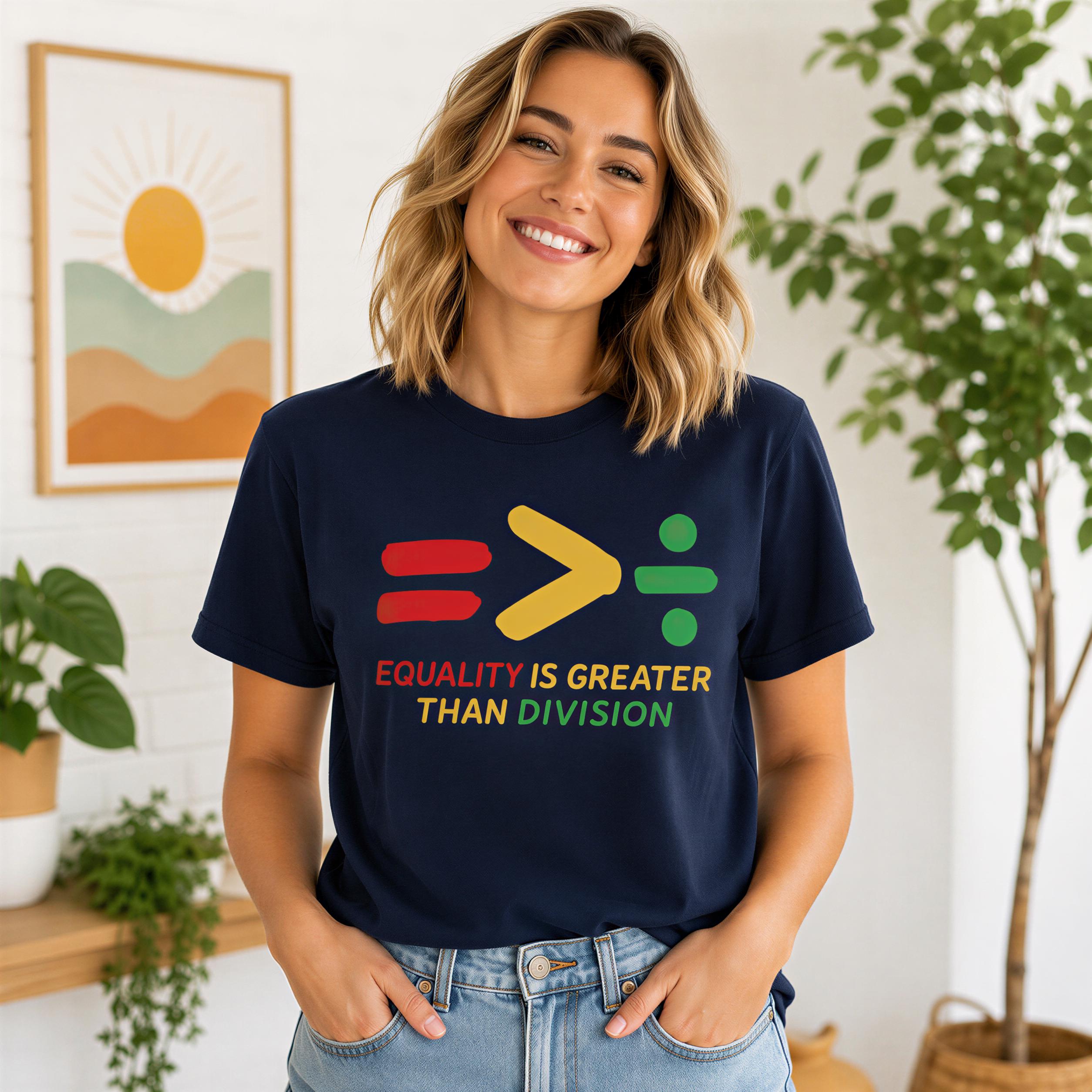 A woman wearing a navy blue t-shirt with a graphic design and text, smiling at the camera.
